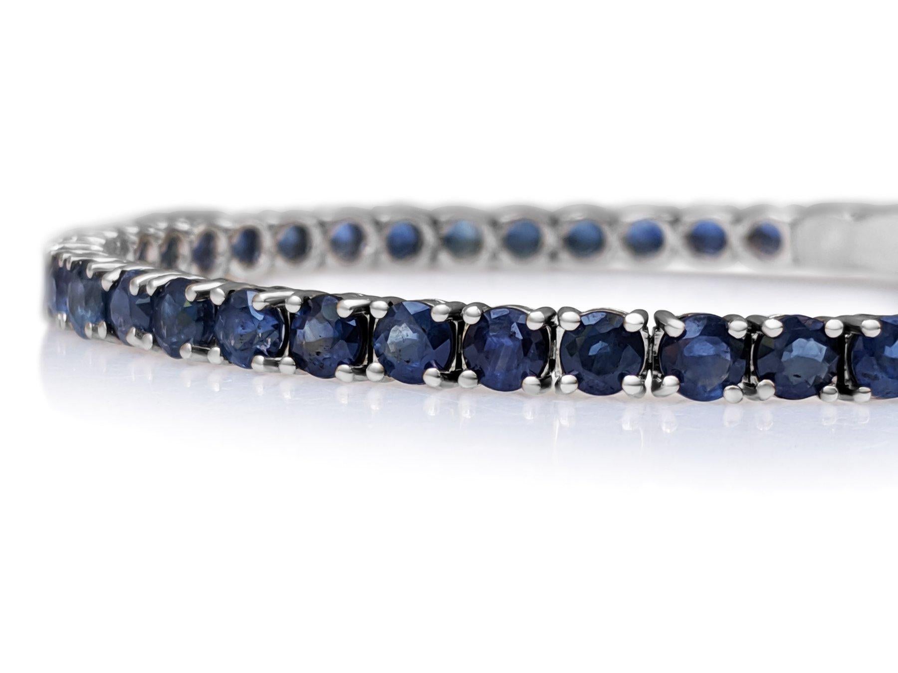 This exquisite bracelet features 10.60 carats of round brilliant blue sapphires, set in 14 kt white gold. The vibrant blue sapphires are beautifully complemented by the sleek white gold setting, creating a piece that radiates elegance and charm.