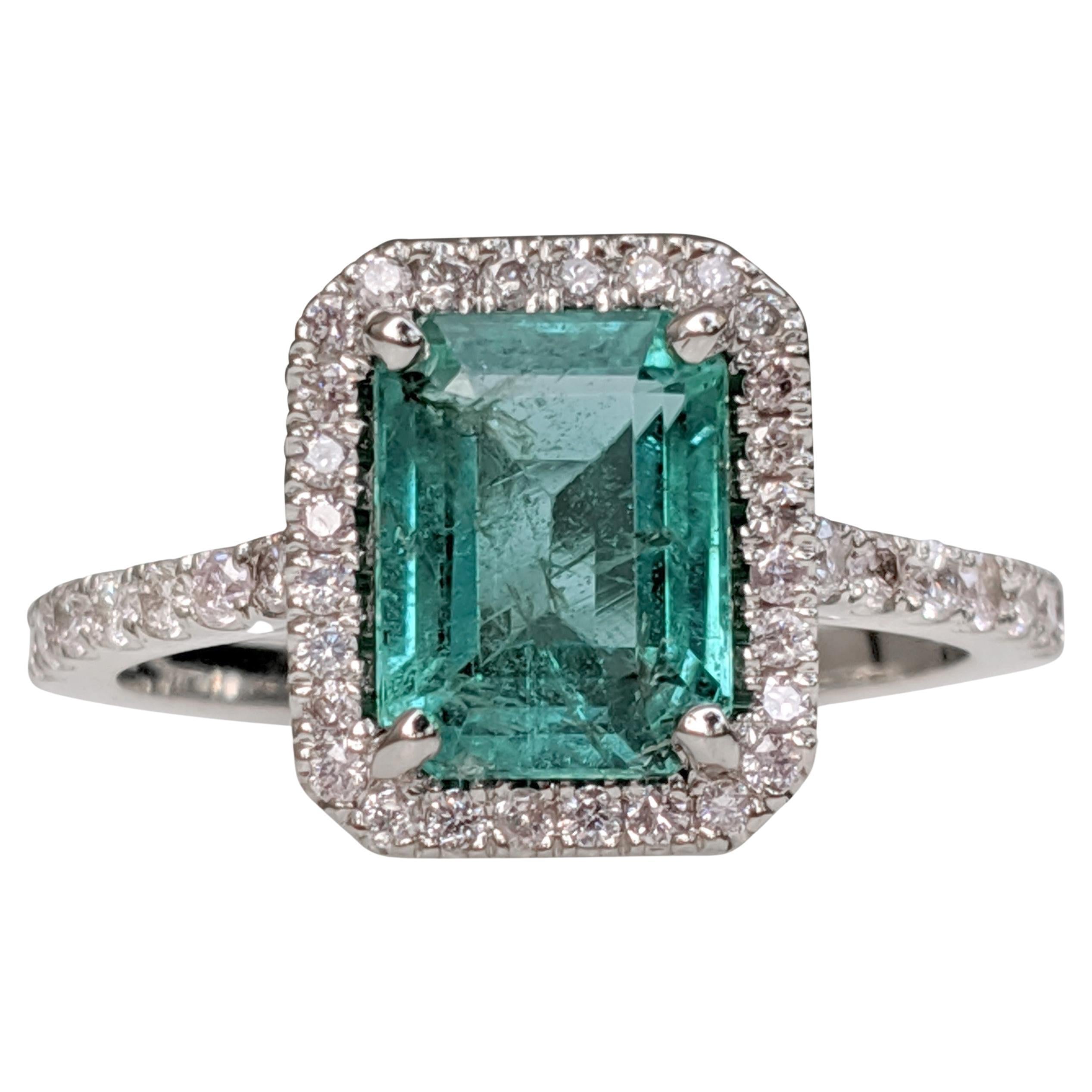 Ring can be resized free of charge prior to shipping out.
Ring Size: 58.5 EU

Center Natural Emerald:
Weight: 2.05 ct
Colour: Green
Shape: Emerald
Minor clarity enhancement

Side Stone Diamonds:
Weight: 0.41 ct / 42 stones
Color: Light Pink -