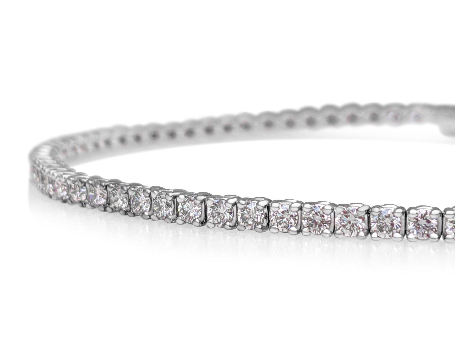 This exquisite bracelet is crafted from 14 kt white gold and adorned with 2.23 carats of natural pink diamonds. Featuring  94 meticulously set diamonds, the bracelet radiates a delicate pink hue that exudes elegance and charm. Certified by GWLab for