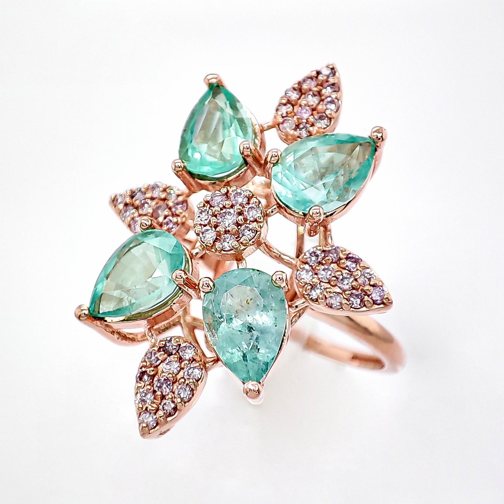 FOR CUSTOMERS FROM THE USA NO VAT

This stunning ring features four natural emeralds in pear shapes, totaling 2.22 carats and displaying a vibrant green color. Accompanying them are 52 round brilliant natural diamonds, totaling 0.34 carats. Crafted
