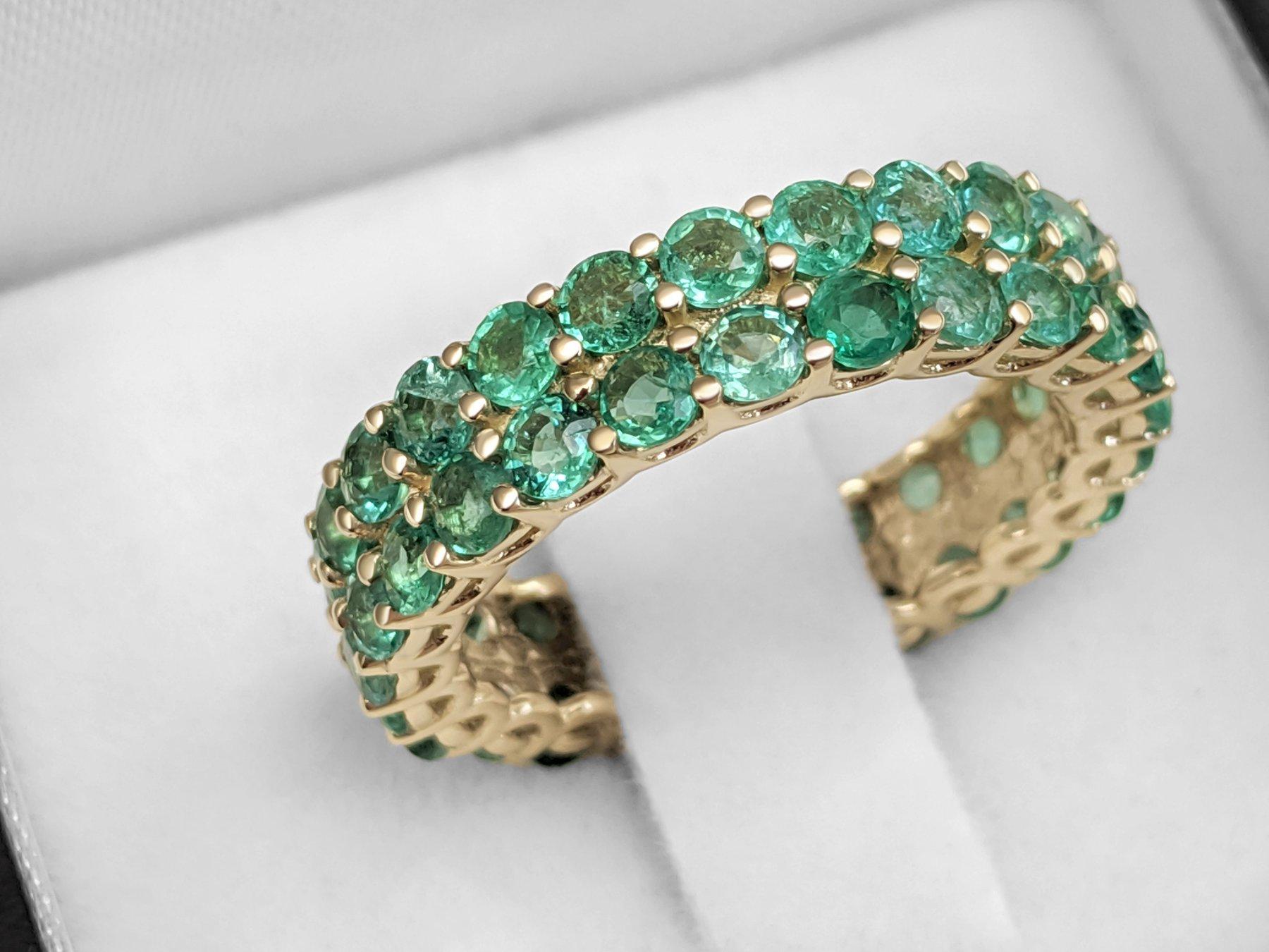 This ring is definitely a show stopper and will draw attention wherever you go! A great gift for yourself or your loved one - a heirloom piece to treasure forever!

Ring Size: 55 EU

Center Natural Emeralds:
Weight: 3.50 ct, 50 stones
Color: