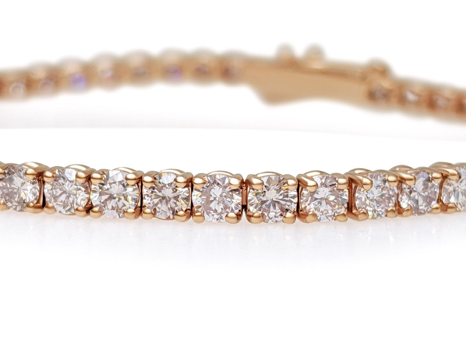 This exquisite bracelet is crafted from 14 kt rose gold and adorned with 5.41 carats of natural pink diamonds. Featuring 62 meticulously set diamonds, the bracelet radiates a delicate pink hue that exudes elegance and charm. Certified by GWLab for