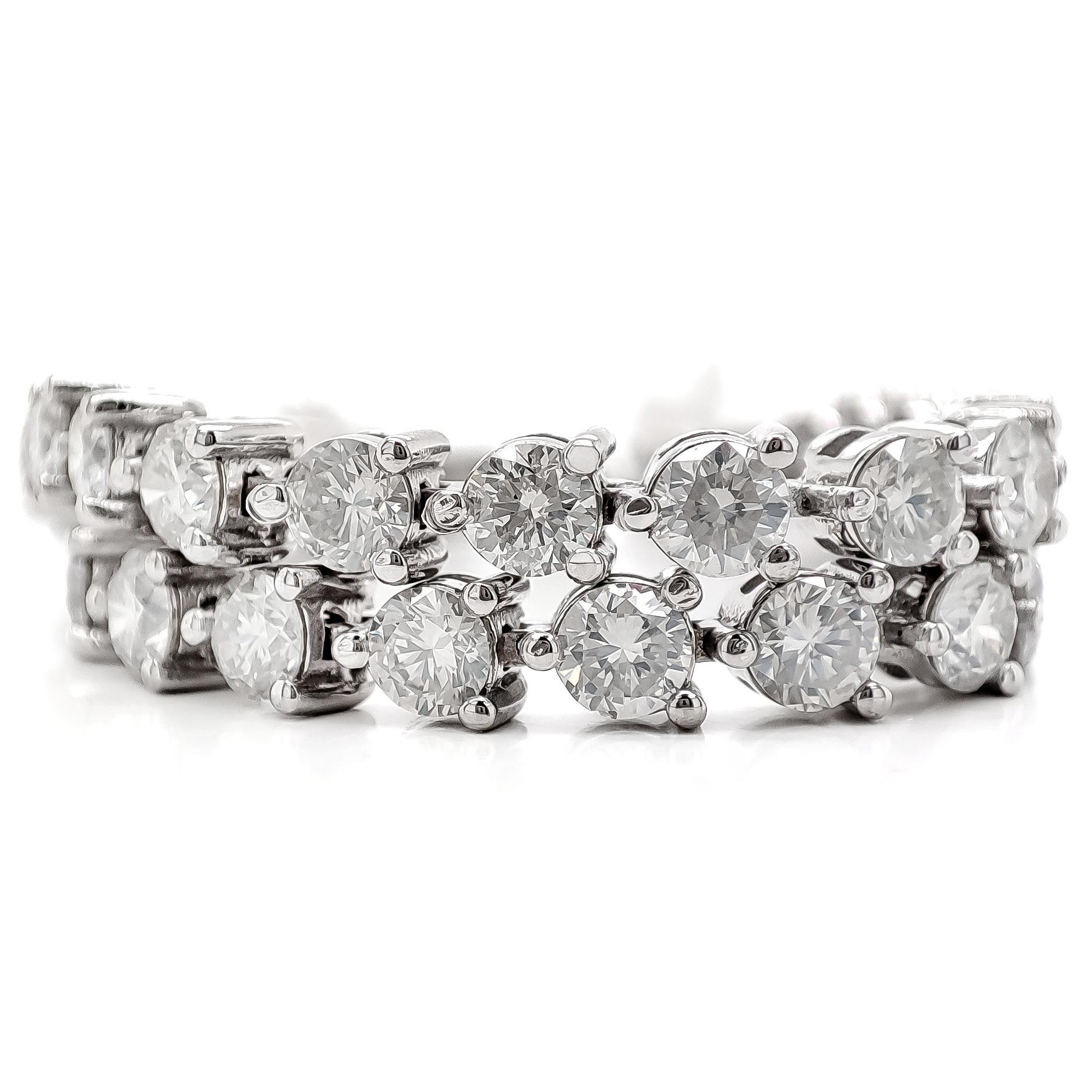 This classic and elegant 14kt white gold tennis bracelet showcases 48 endlessly sparkling diamonds, totaling 5.5 carats. This bracelet will give your favorite outfits an unforgettable sparkle. 
For more information, please check the attached