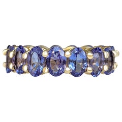 No Reserve, 6.60 Carat Natural Tanzanite Eternity Band 14 Karat Yellow Gold Ring