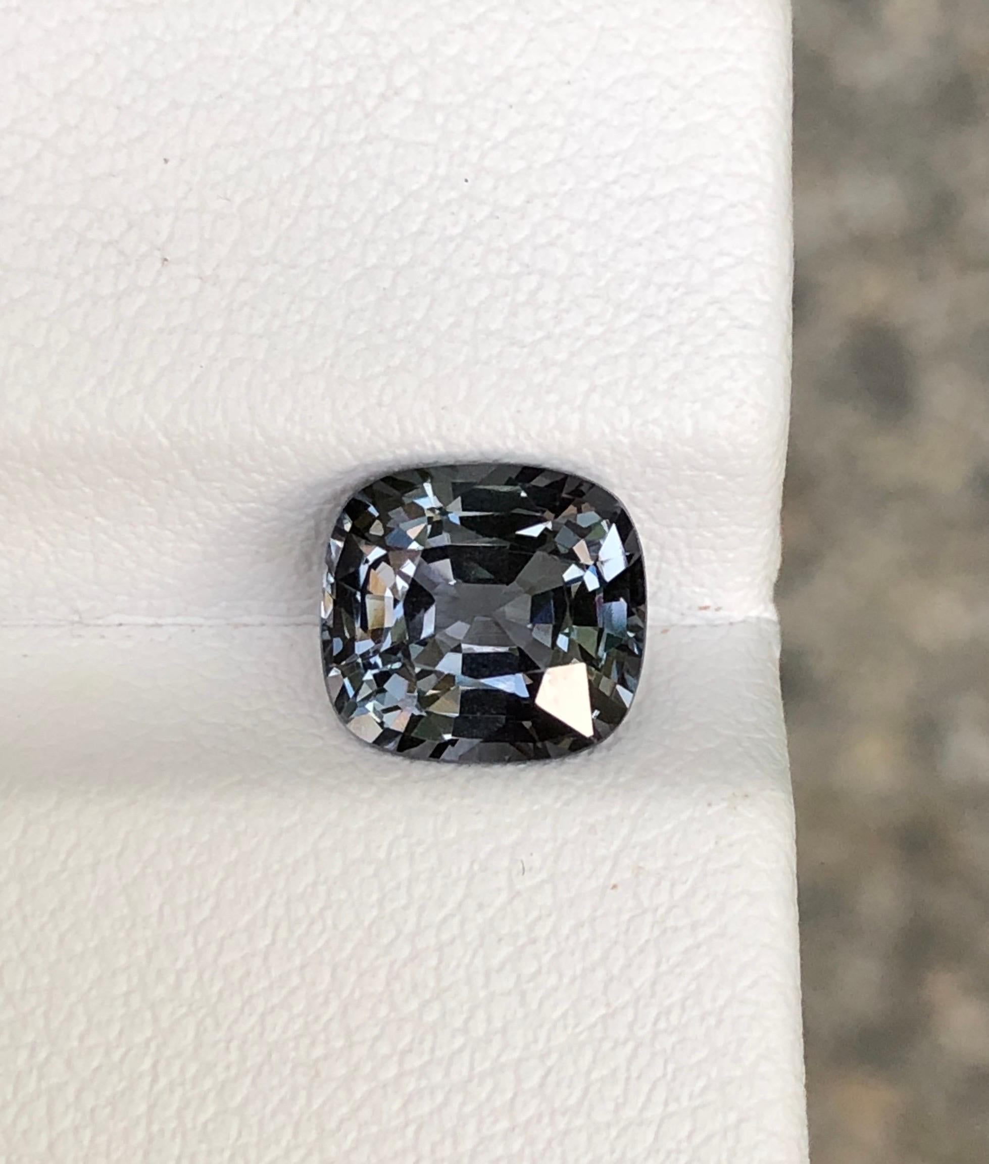 Introducing an exquisite addition to our collection: a pristine 2.5 carat spinel loupe featuring an open grey cushion cut. This elegant piece exudes sophistication and charm, perfect for those who appreciate fine craftsmanship and timeless beauty.