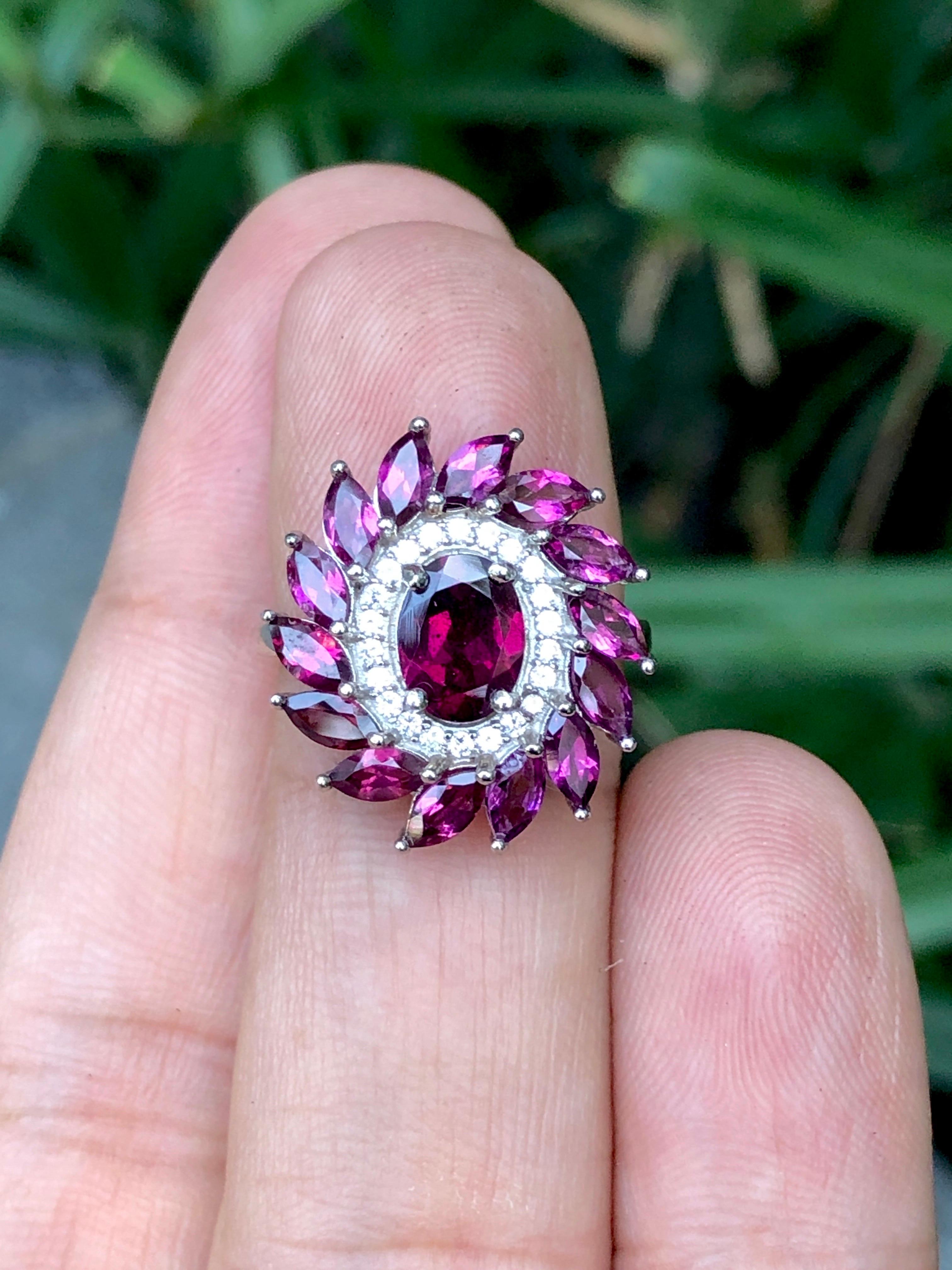 Discover elegance with our exquisite Rhodolite Garnet ring featuring dazzling cubic zirconia accents. Crafted from premium 925 silver, this ring exudes sophistication and charm. Elevate your style with the captivating allure of deep red garnet and