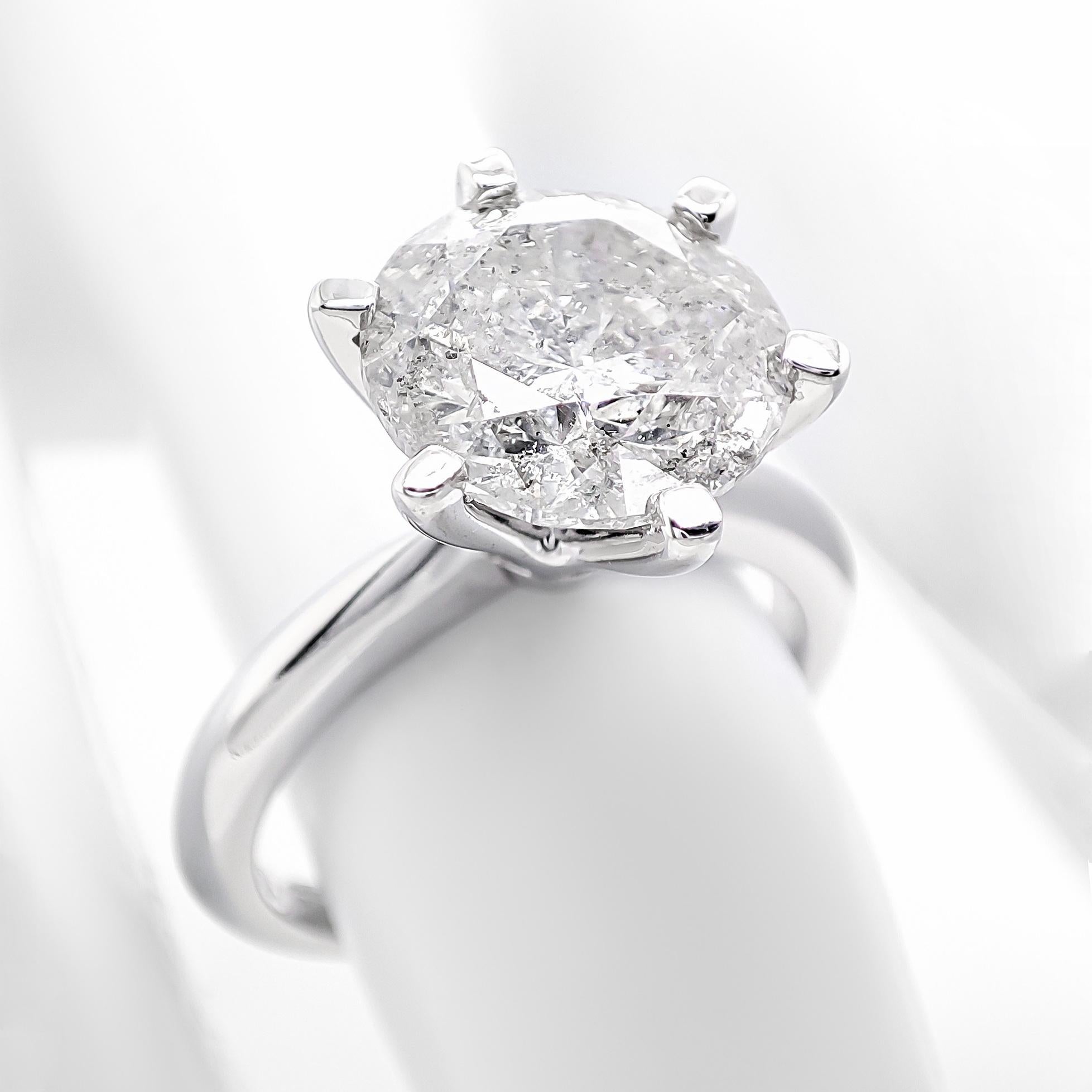 FOR U.S. BUYERS NO VAT NO CUSTOMS FEES

The ring features a stunning 3.62-carat natural round brilliant diamond with an F color grade as its center stone. Crafted from 14 kt white gold, the setting complements the diamond's brilliance and color