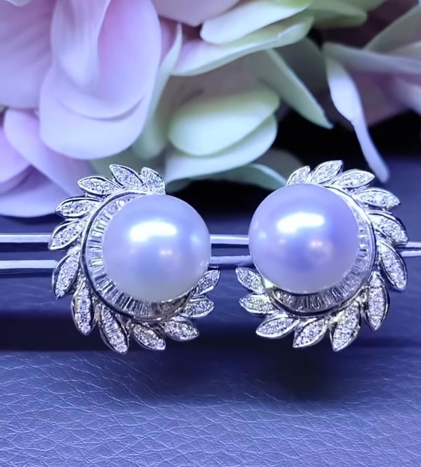 An exclusive pair of earring , so luxurious , refined design , very sophisticated style.
Earrings come with two South Sea Pearls of about 13 mm and natural 
diamonds in  baguettes  and round cut , of 1,50 carats  F/VS.
Very beautiful piece.
Handmade