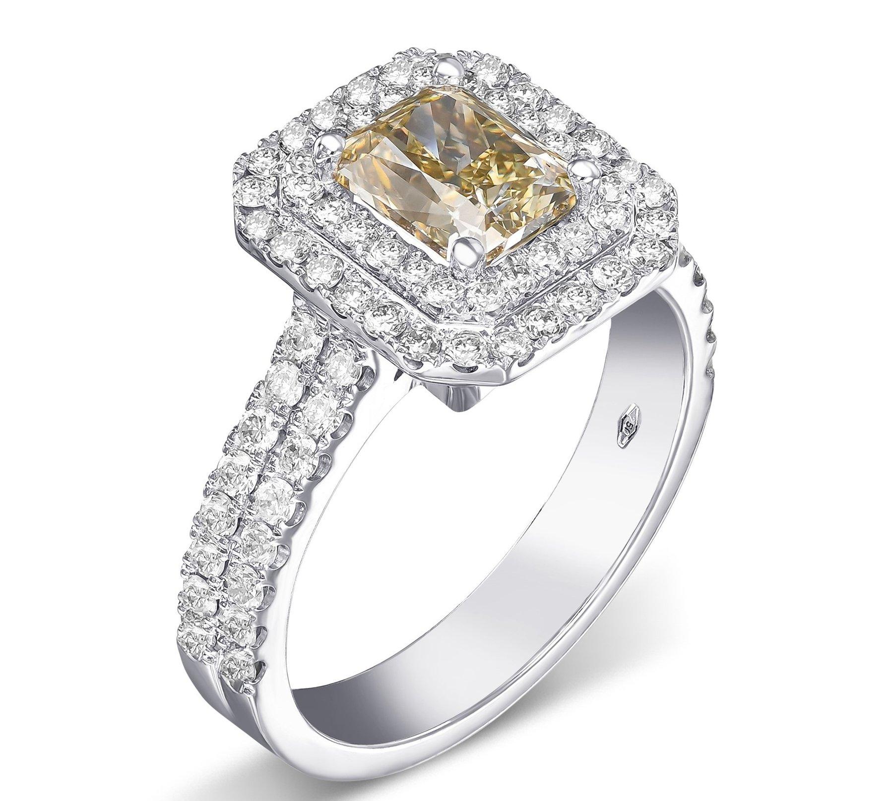 Today we are offering this amazing ring featuring a center 1.50 carat fancy brownish yellow diamond and 0.50 cttw diamonds halo ring. 
18 kt. White gold
Size: 56 EU / 7.75 US
Total weight: 7.28 g

Ring can be resized free of charge prior to shipping