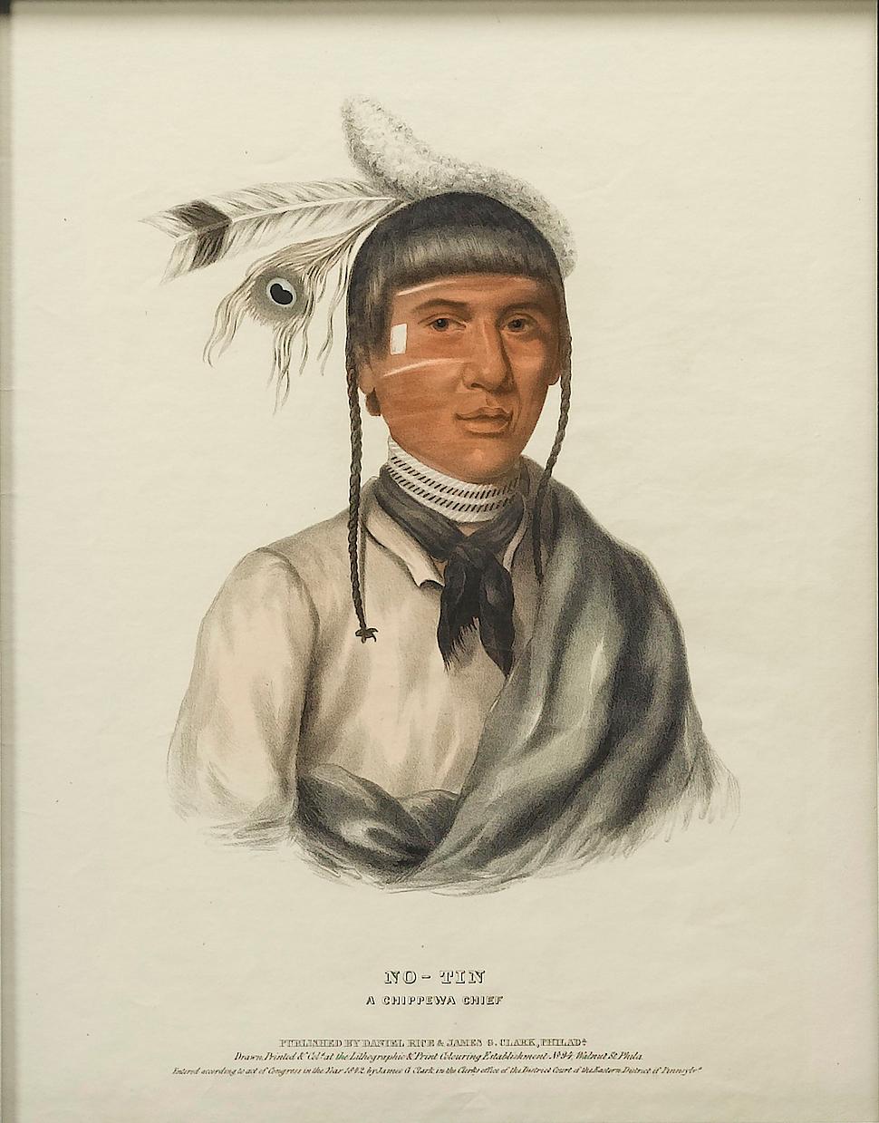 This is a striking lithographic portrait of No-Tin, a Chippewa Chief, from McKenney and Hall’s three-volume work, Indian Tribes of North America. This portrait was printed in 1838 and is paired with an antique Native American arrowhead. No-Tin, also