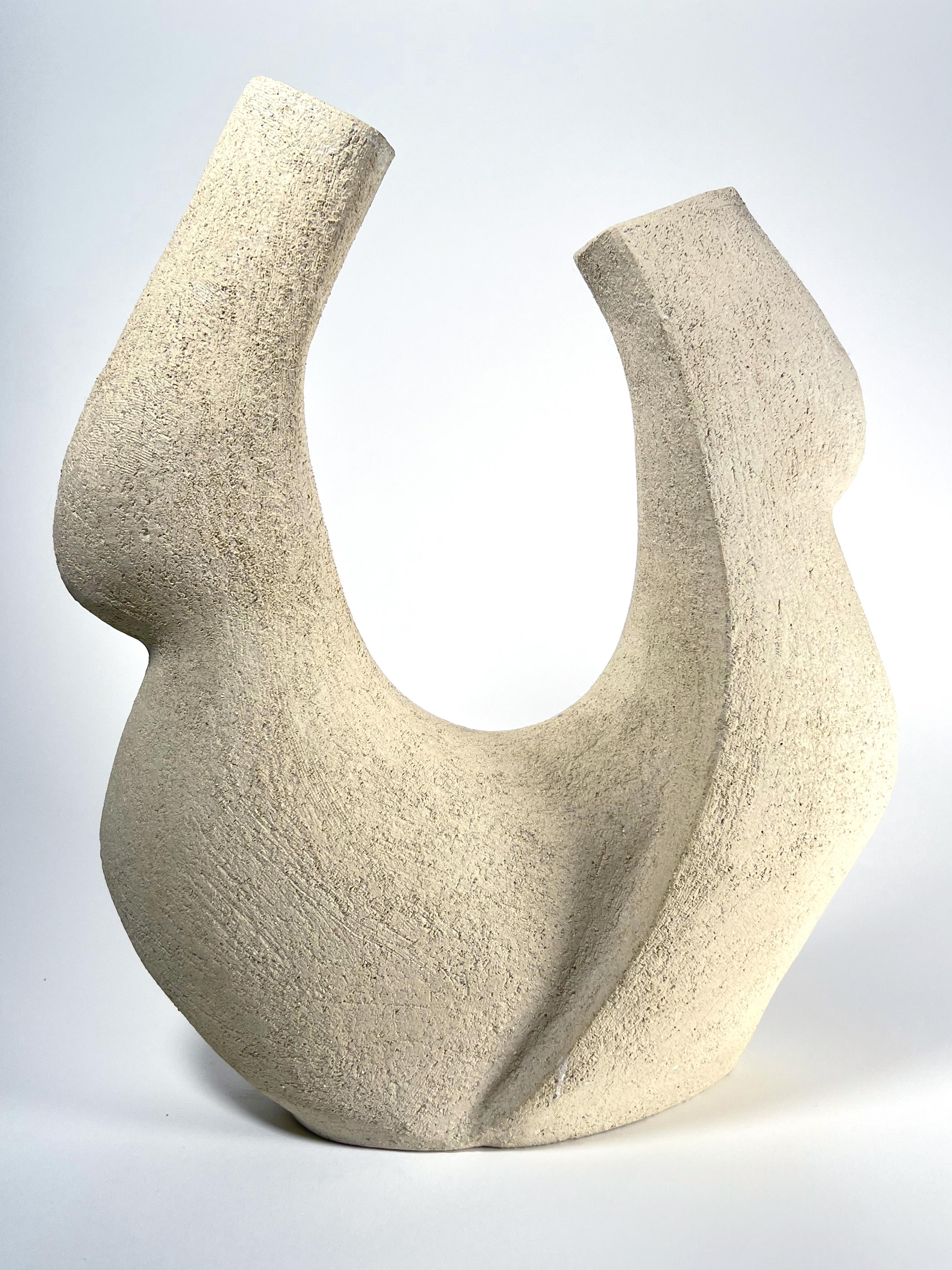 This handcrafted ceramic vessel by Doris Josovitz, from Lost Quarry, is a beautiful expression of timeless artistry, designed to bring warmth and elegance to your space. Sculpted with intention, its textured white clay finish feels as natural as it