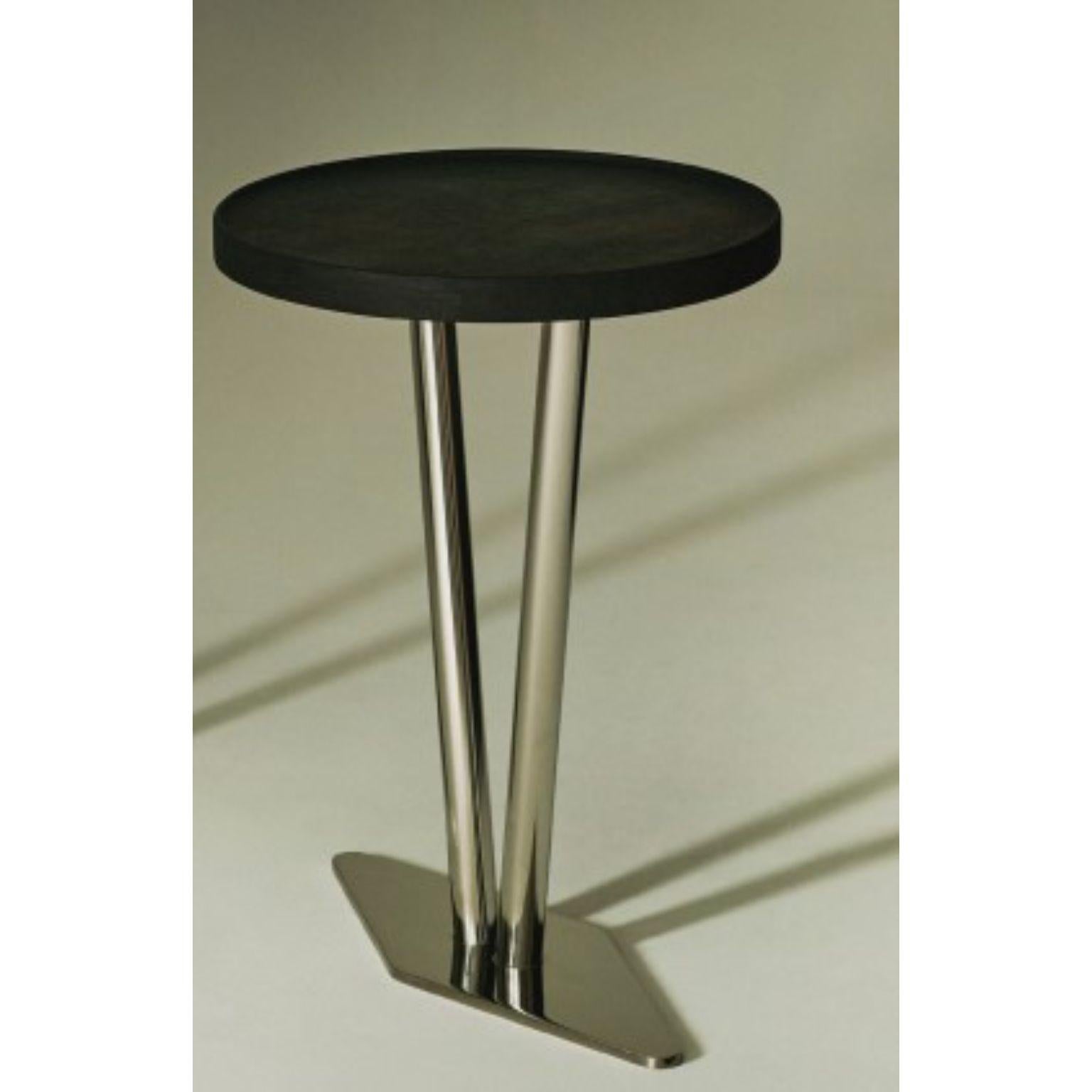 No.0322 side table by Olivia Bossy
Limited Edition of 6 
Dimensions: D 53 x W 45 x H 63 cm
Materials: Ebonised oak, stainless steel.

A collection born of fire, Euclidean geometry and the display mechanism of museum artefacts.

From a
