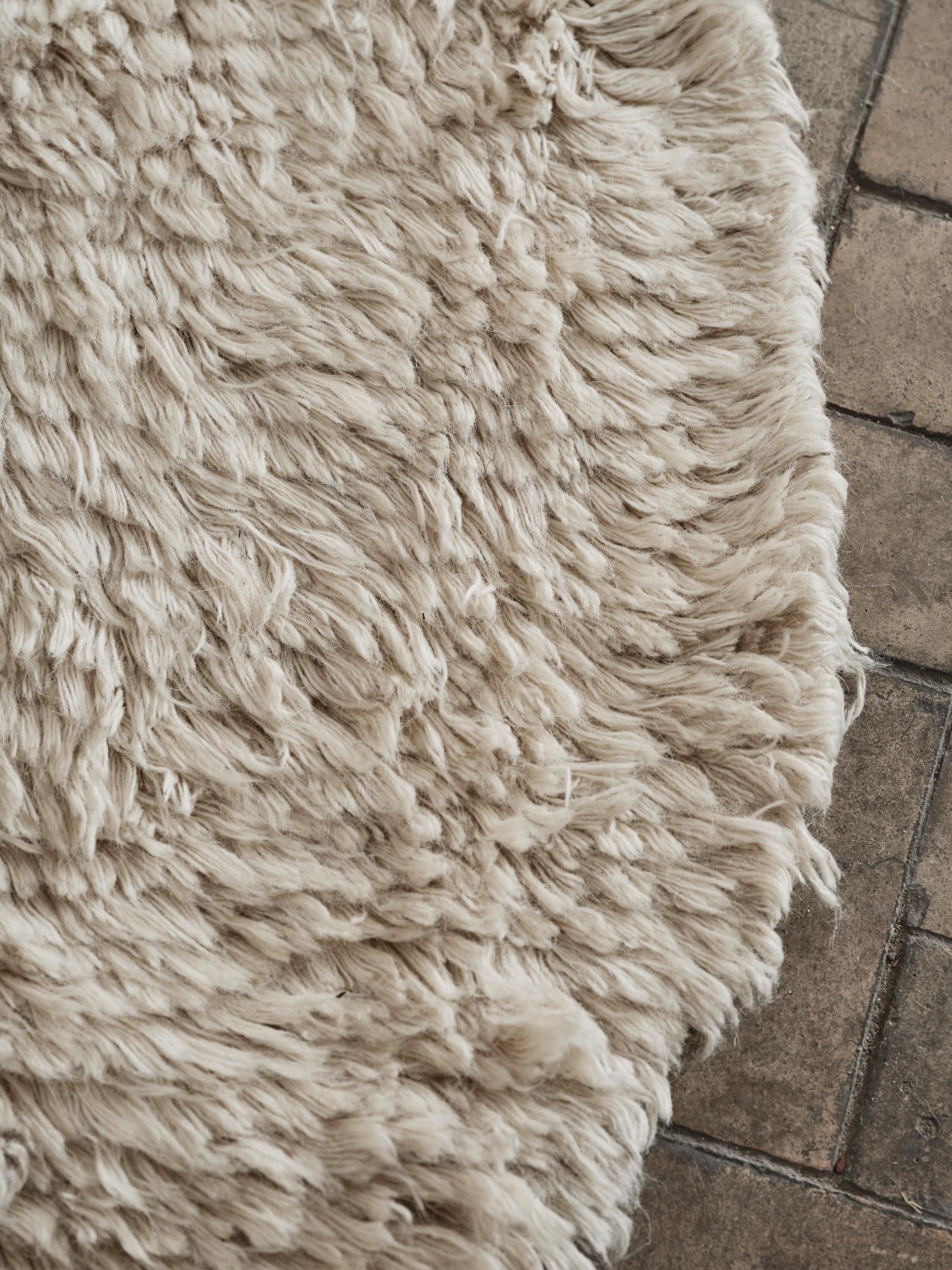 No.09 Rug by Cappelen Dimyr
Dimensions: D290 x H350 cm
Materials: 85% wool 15% cotton

no.09 is a soft and artistic statement piece with an understated bohemian elegance. Its organic and irregular shape is created in a downy crème off-white
