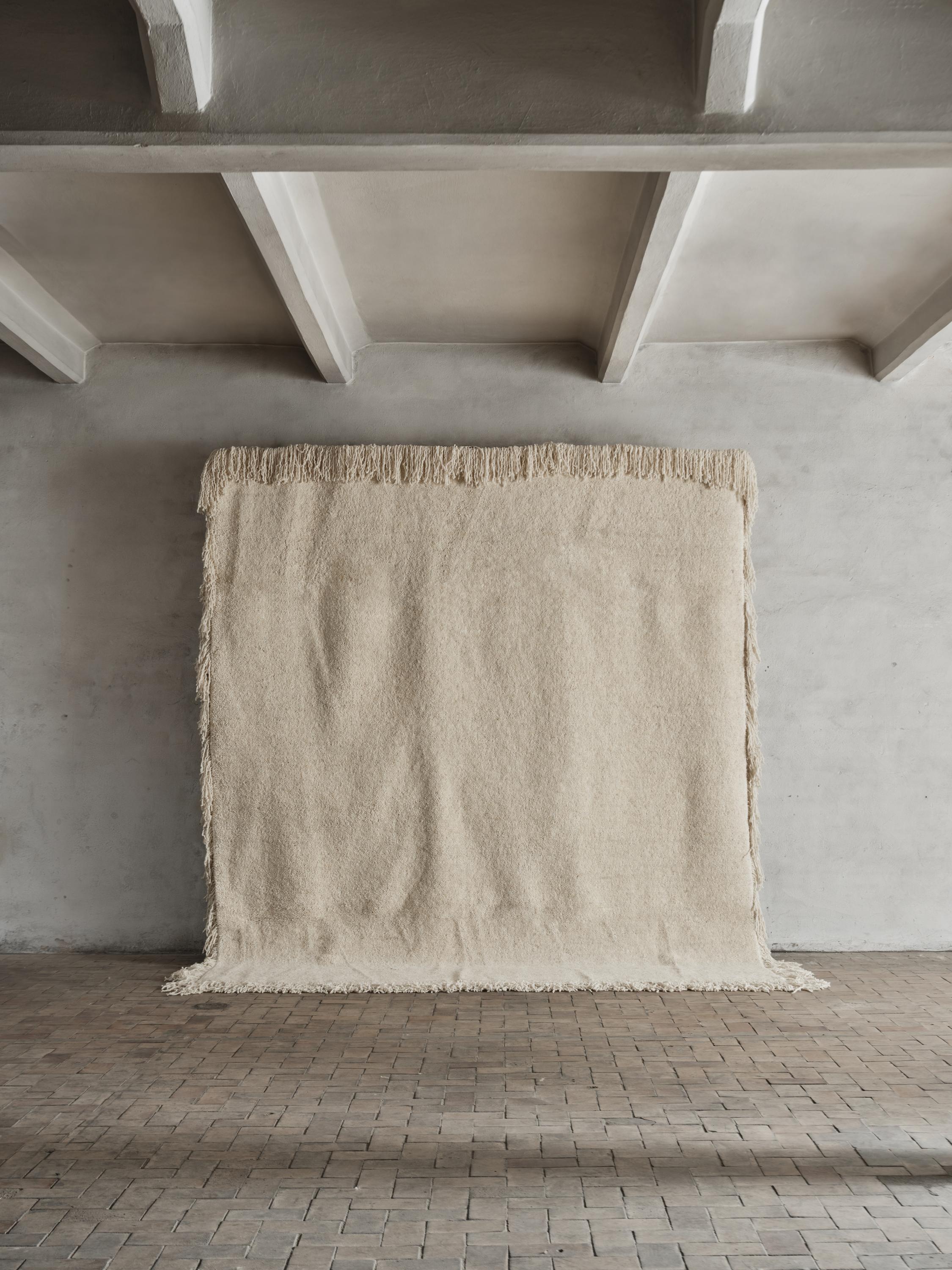 No.10 Rug by Cappelen Dimyr
Dimensions: D290 x H350 cm
Materials: 85% wool 15% cotton

no.10 is an elevated yet classic rug with exaggerated details. The heavy and compact rug in luxury chunky wool is cut in a short pile with bold and curly