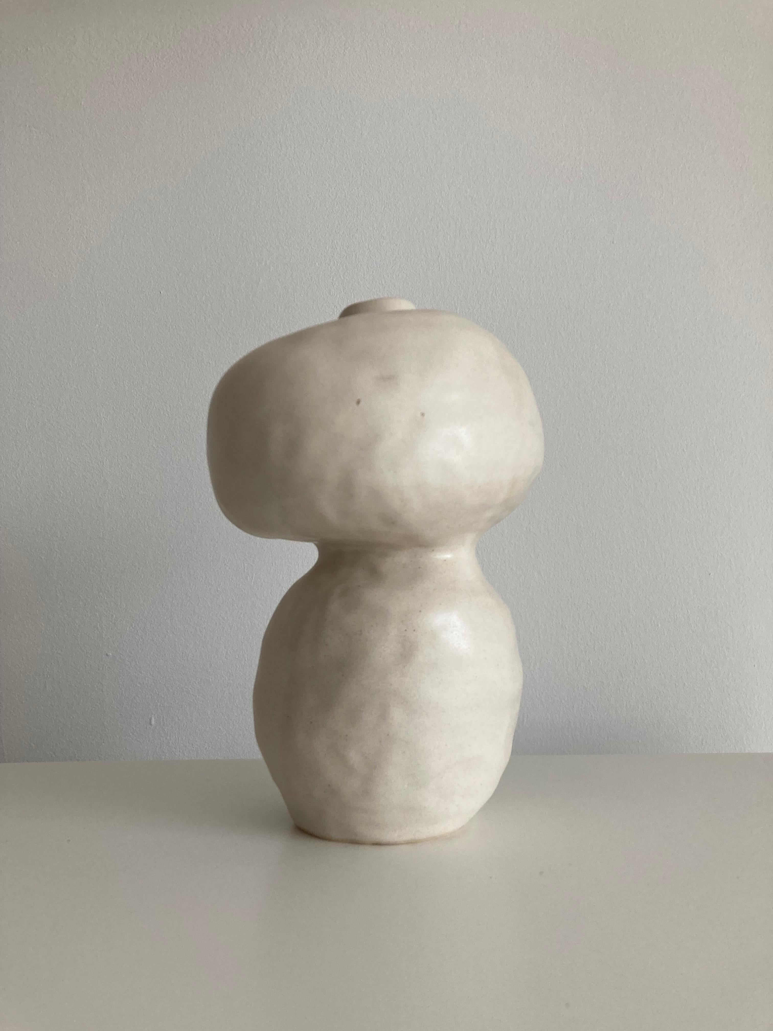 No.98 stoneware sculpture, Tonfisk by Ciona Lee 
One of a Kind
Dimensions: Ø 13 x H 19 cm
Materials: White stoneware, satin cream glaze
Variations of size and colour available

Tonfisk is the ceramic practice by Ciona Lee, a Korean-Italian