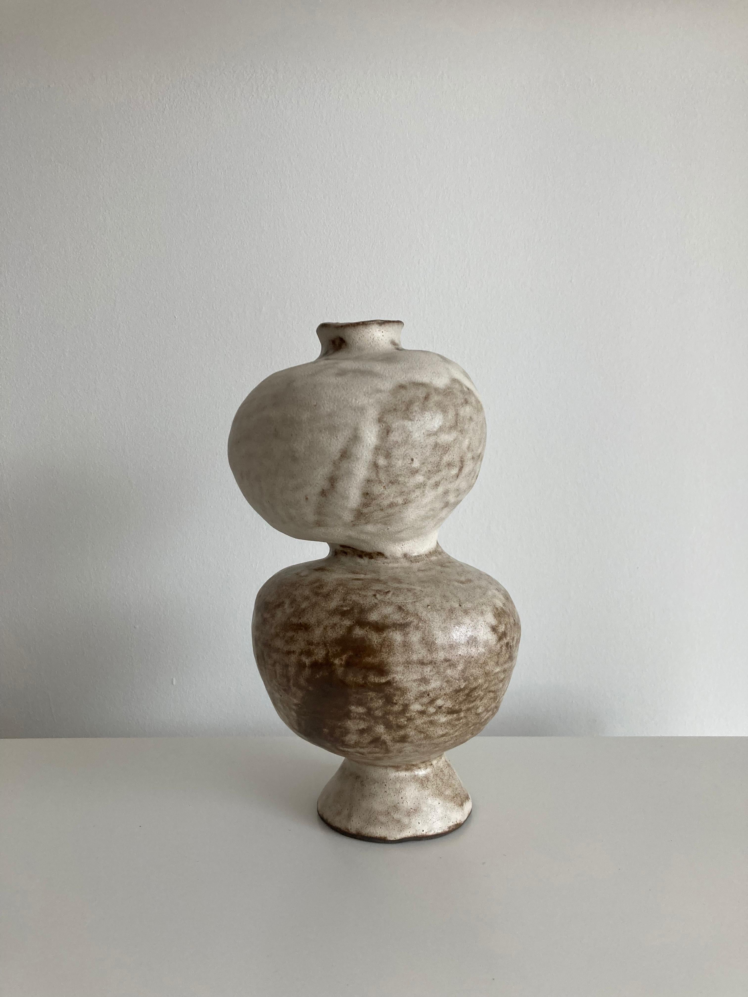 No.104 Stoneware sculpture, Tonfisk by Ciona Lee 
One of a Kind
Dimensions: Ø 15 x H 24 cm
Materials: Black stoneware, Satin Cream Glaze
Variations of size and colour available.

Tonfisk is the ceramic practice by Ciona Lee, a Korean-Italian