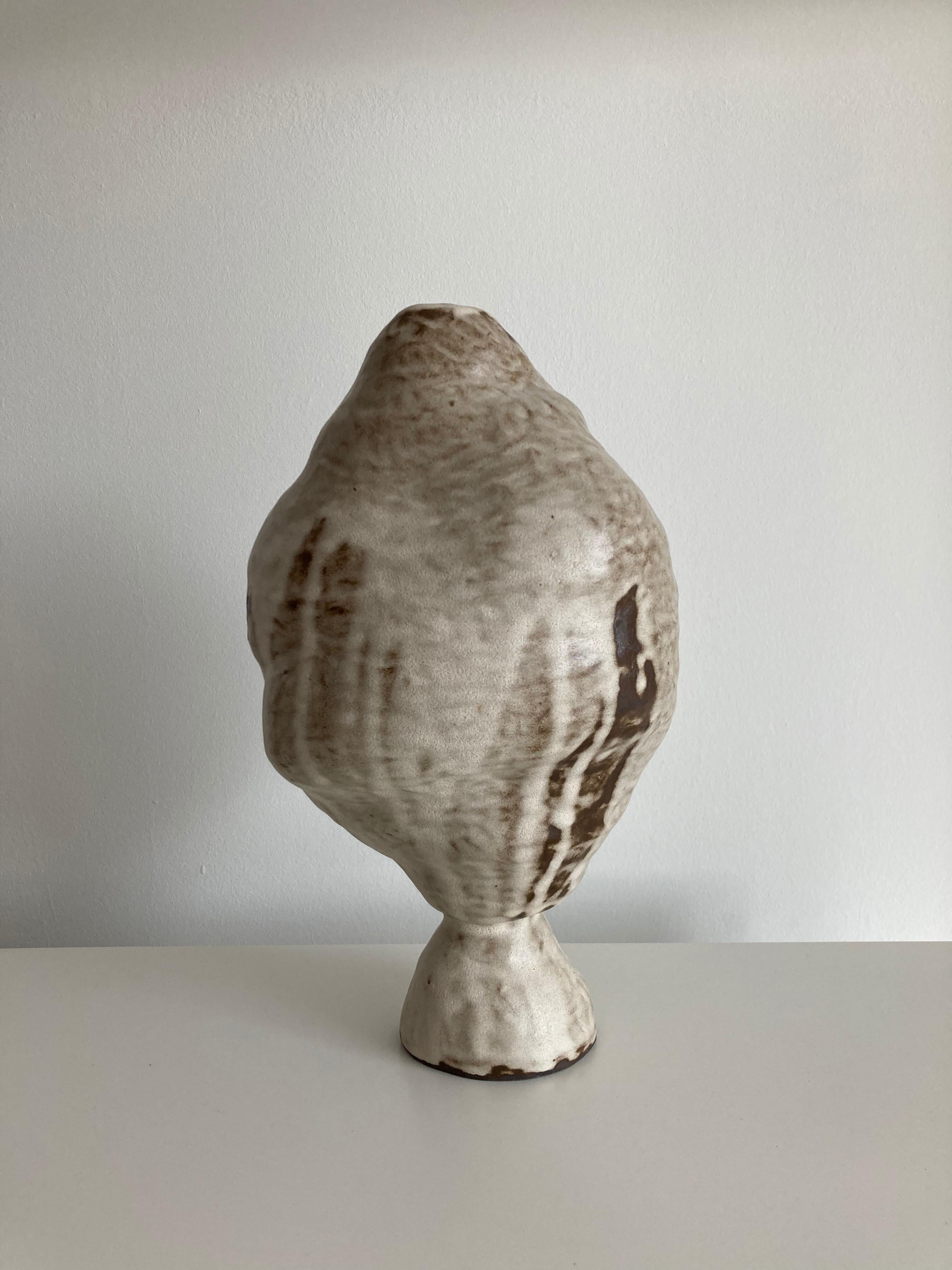 No.106 stoneware sculpture, Tonfisk by Ciona Lee 
One of a Kind
Dimensions: Ø 17 x H 28 cm
Materials: Black stoneware, satin cream glaze
Variations of size and colour available,

Tonfisk is the ceramic practice by Ciona Lee, a Korean-Italian