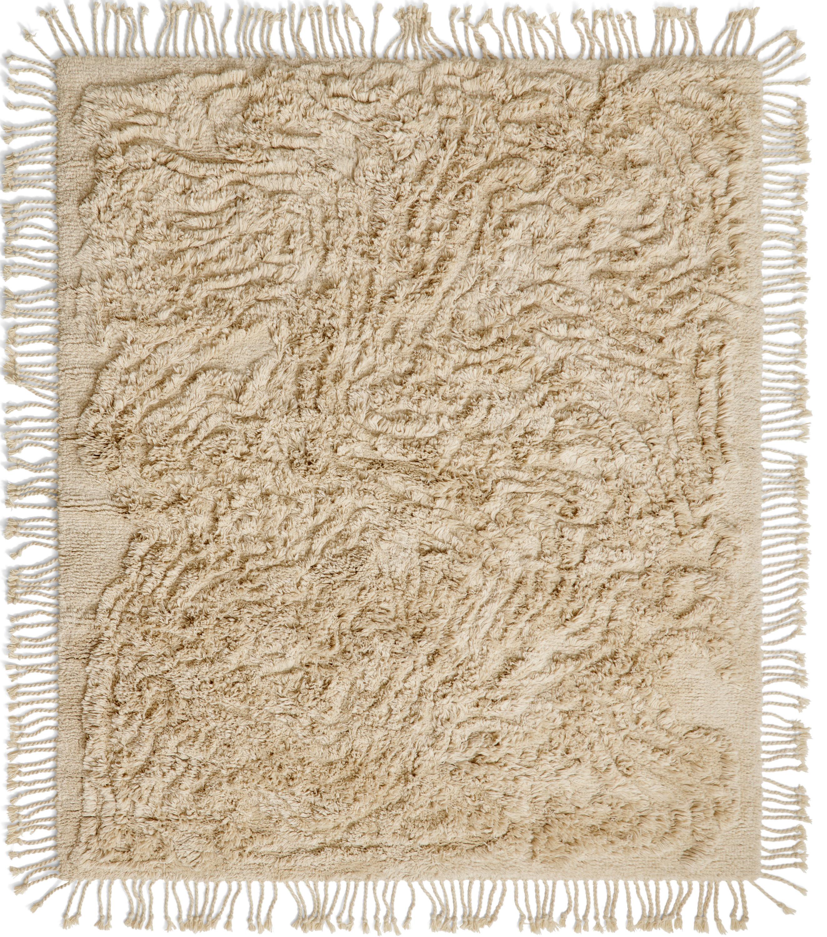No.13 Rug by Cappelen Dimyr
Dimensions: D290 x H350 cm
Materials: 85% wool 15% cotton

no.13 is fully hand-knotted and sports a hand cut pattern. The twisted wool fringes along all sides of the rug are a striking emphasis on its artistic