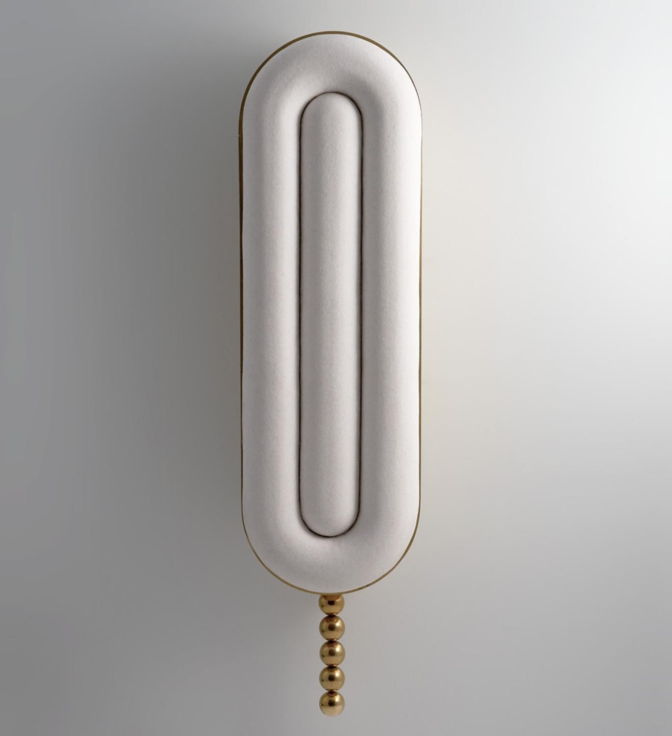 Manufactured in Manhattan, the Nº159 Wall Lamp is constructed from a solid brass frame, porcelain slip cast lens, LED illumination and a grand pull chain. Collection Nº1 / Tripartite from Avoirdupois is the visual division of three. Every piece