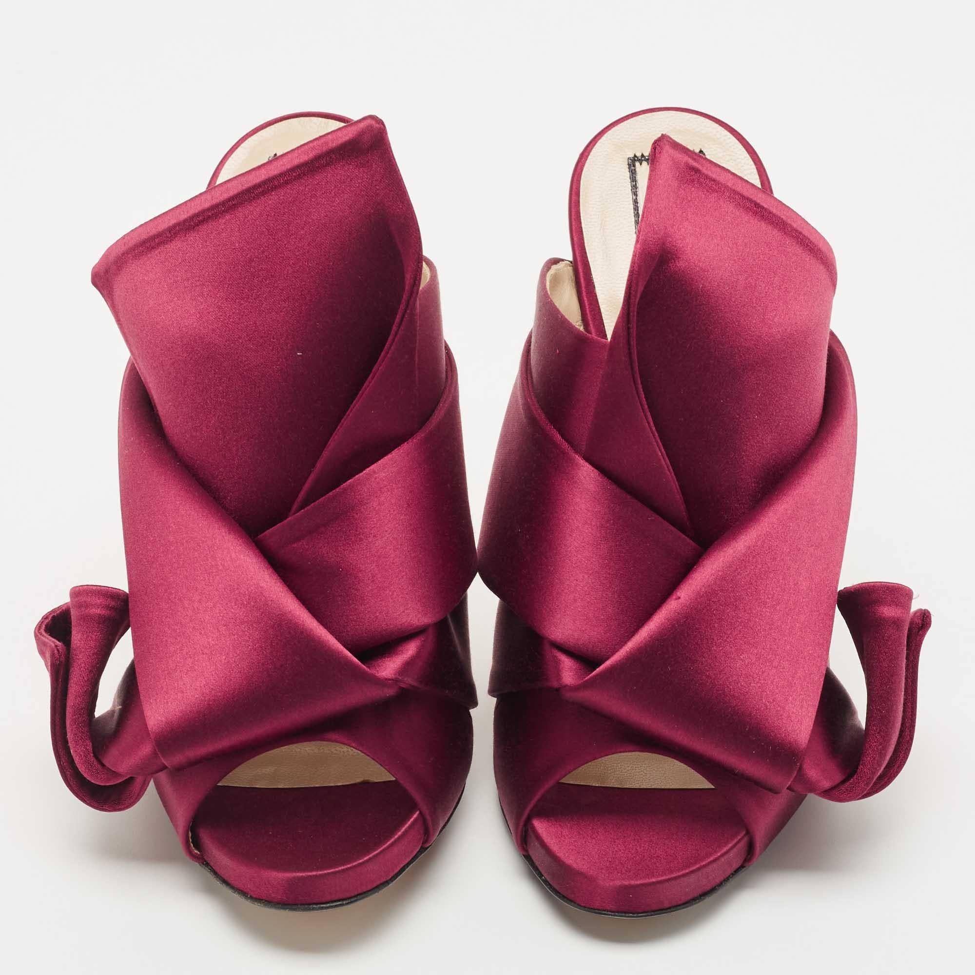 These conversation-starter Ronny sandals from N°21 are worth the buy. Crafted from burgundy satin, this pair of slip-on slides is ornate with a draped pleat detail on the vamp. The insoles are lined with leather and complete with stiletto