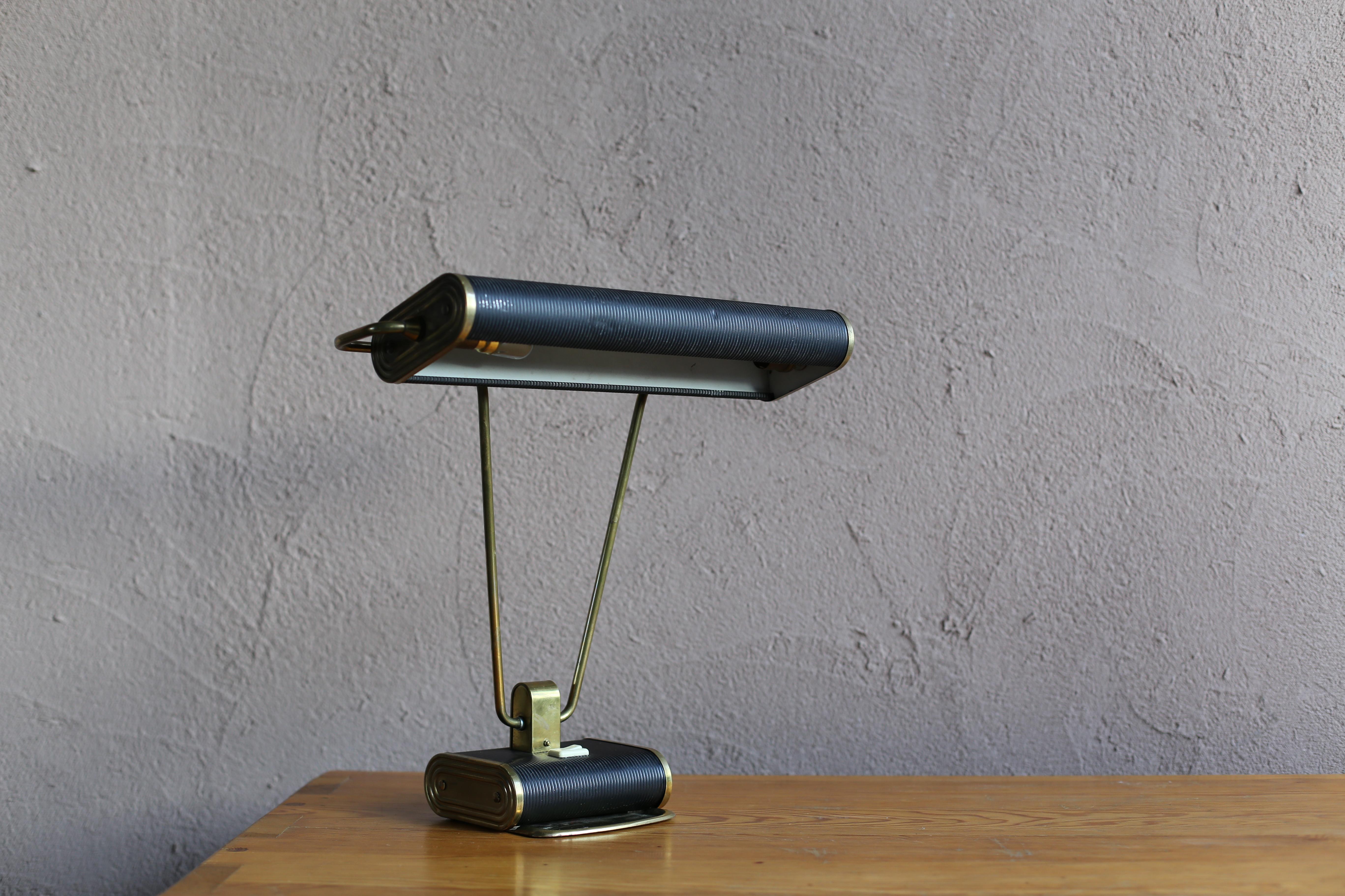 Vintage desk lamp designed by Eileen Gray. Manufacture is Maison Jumo from France. The arm and shade can each be moved a lot.