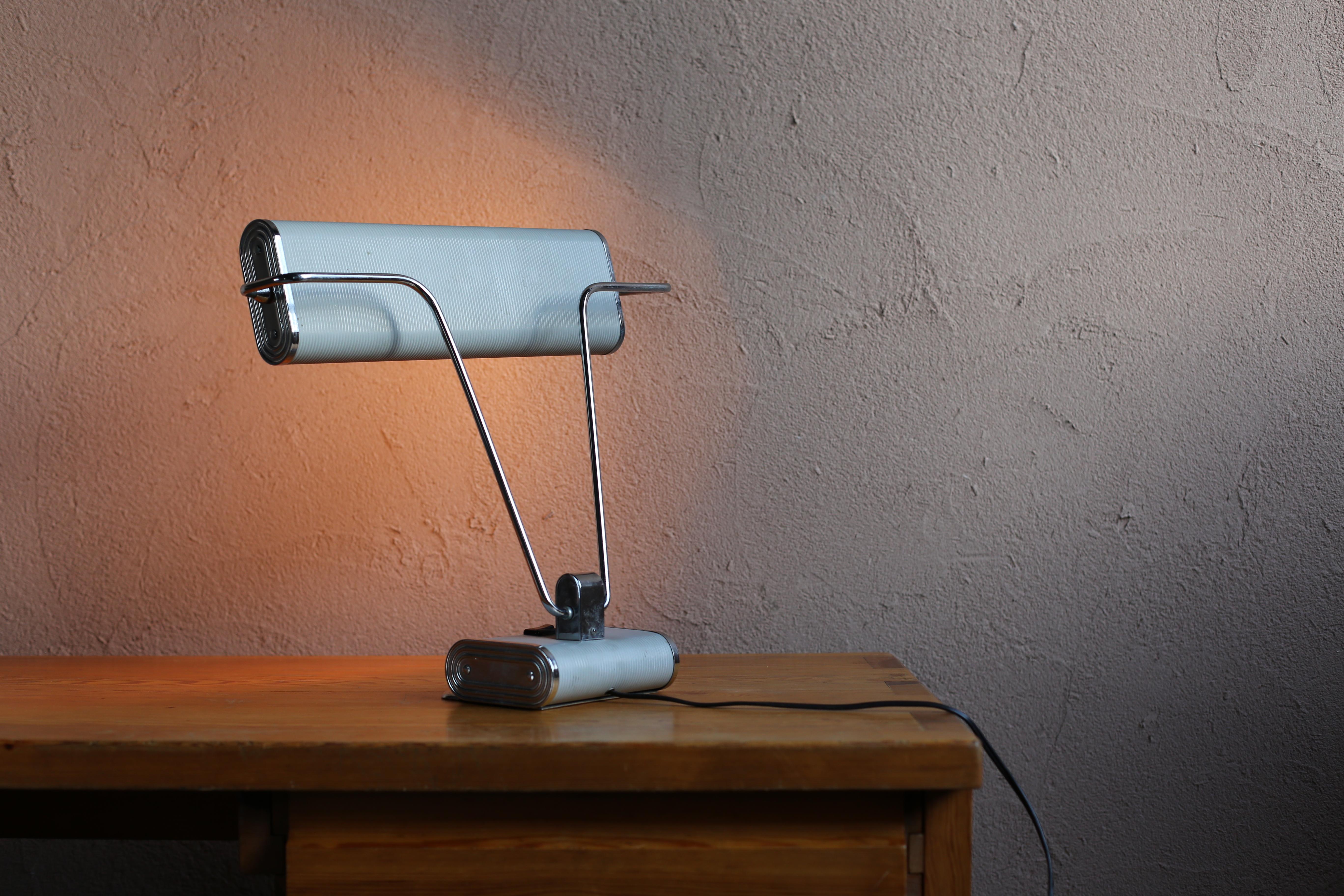 Vintage desk lamp designed by Eileen Gray. Manufacture is Maison JUMO from France. The arm and shade can each be moved a lot.