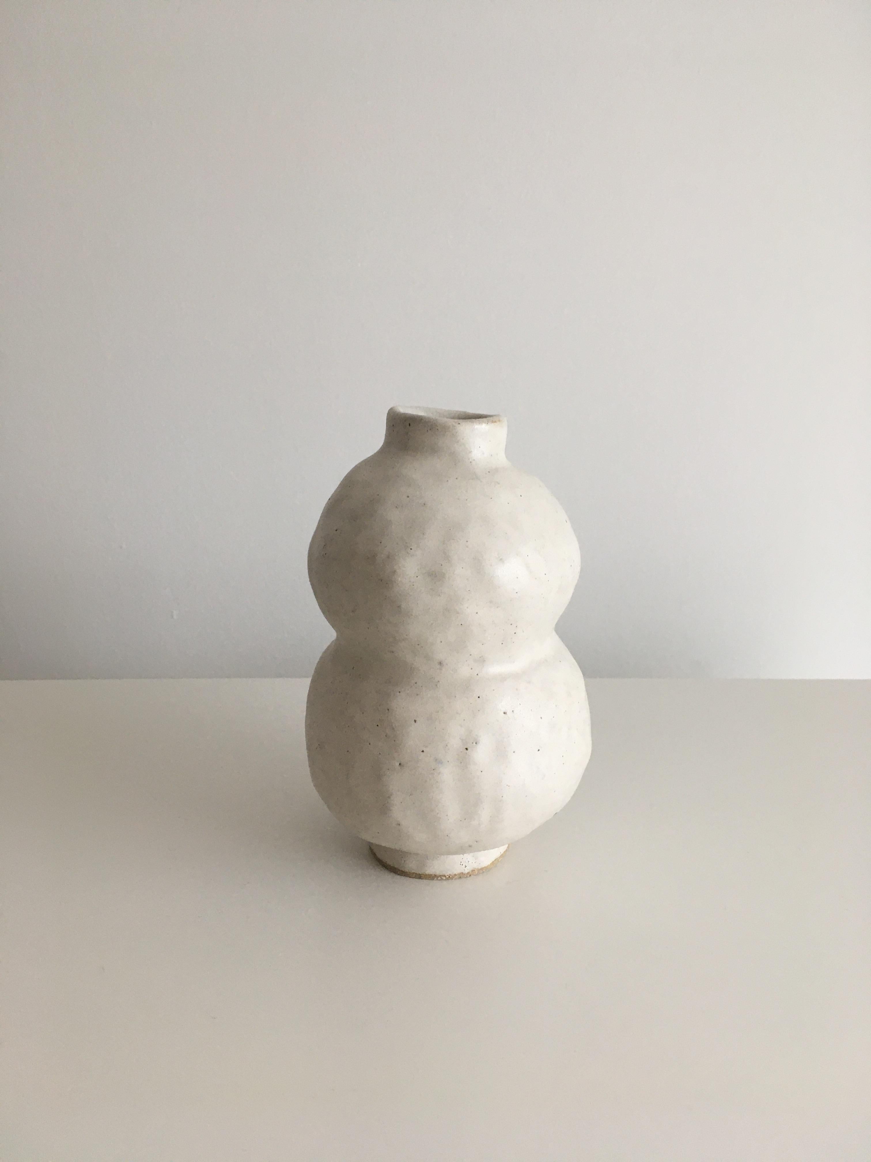 No.89 stoneware sculpture, Tonfisk by Ciona Lee 
One of a Kind
Dimensions: Ø 9 x H 14 cm
Materials: Grogged stoneware, satin cream glaze
Variations of size and colour available

Tonfisk is the ceramic practice by Ciona Lee, a Korean-Italian