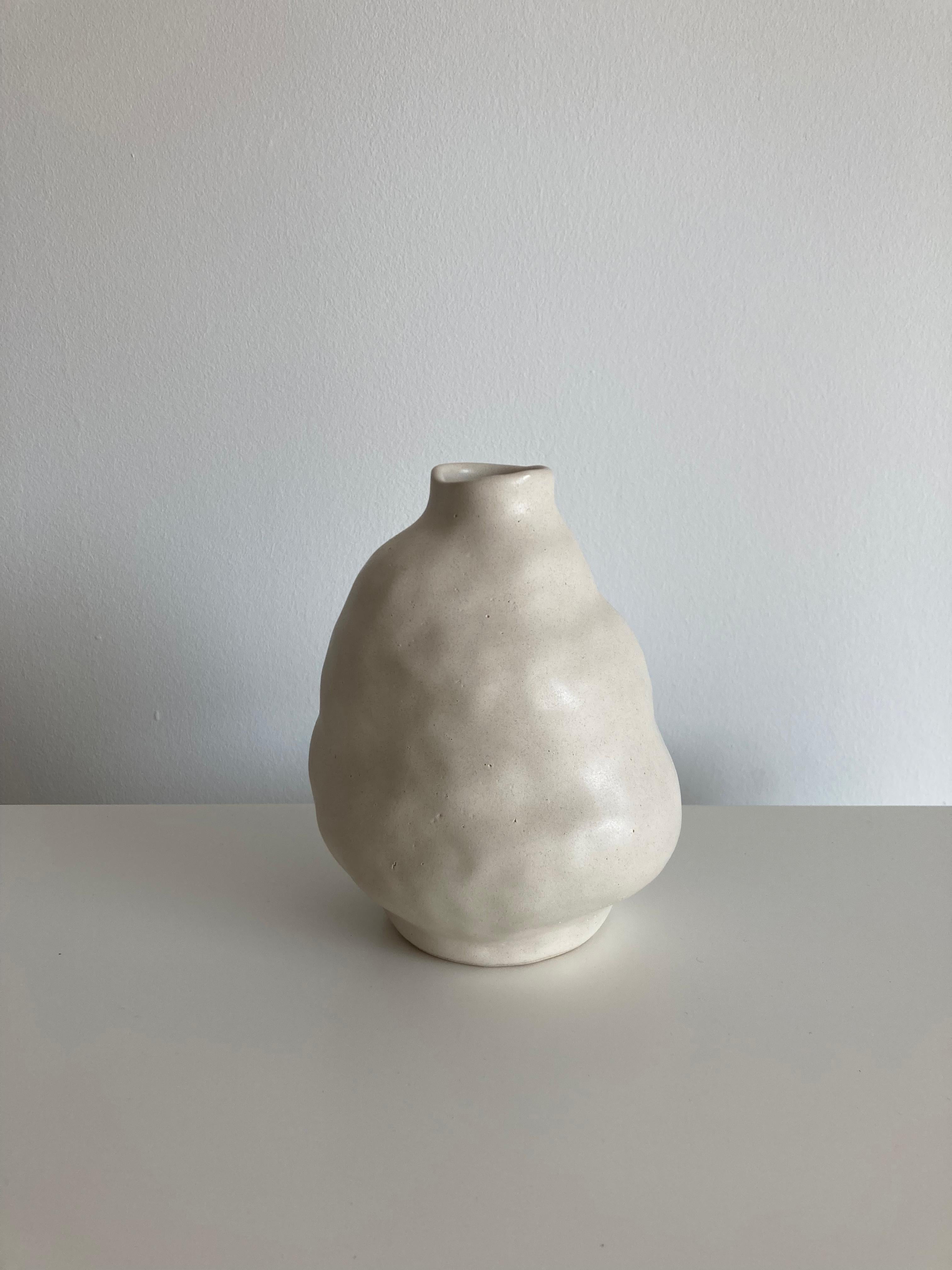No.90 stoneware sculpture, Tonfisk by Ciona Lee 
One of a Kind
Dimensions: Ø 11 x H 15 cm
Materials: White stoneware, satin cream glaze
Variations of size and colour available

Tonfisk is the ceramic practice by Ciona Lee, a Korean-Italian