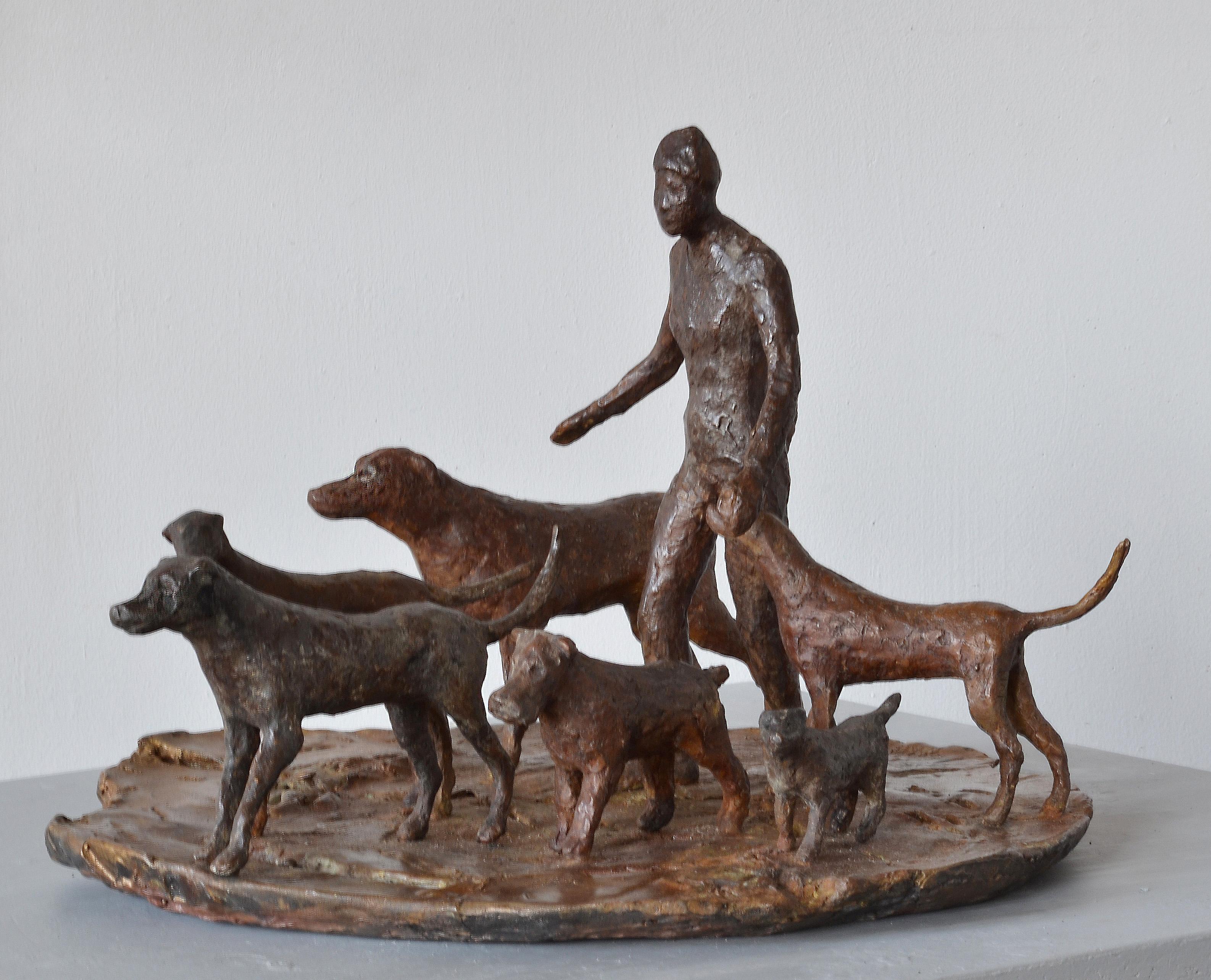 The dogs and their human companion bravely traverse an endangered earth. Cast bronze sculpture, in an edition of 5.
The human figure is 7 ½” x 4” x 2 ½”; the largest dog is 3 ½” h x 6 ½” long x 1 ¼” wide; the smallest dog is: 1 ½” x 2 ¾” x ½”, the