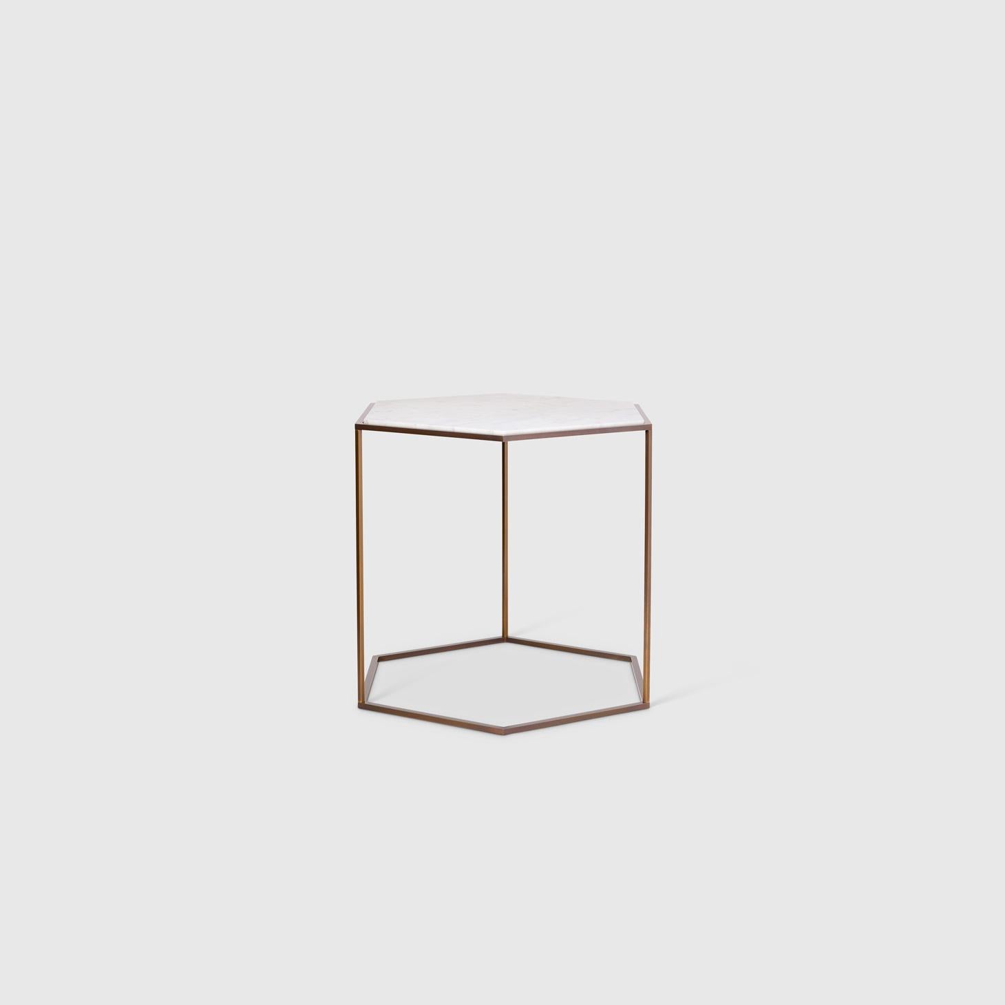 The Nob Hill side tables by Yabu Pushelberg mirror the topography of the area known for a commanding view over San Francisco. The table available in three sizes also comes in two finish pairings; smoked brass with a Carrara marble top and smoked