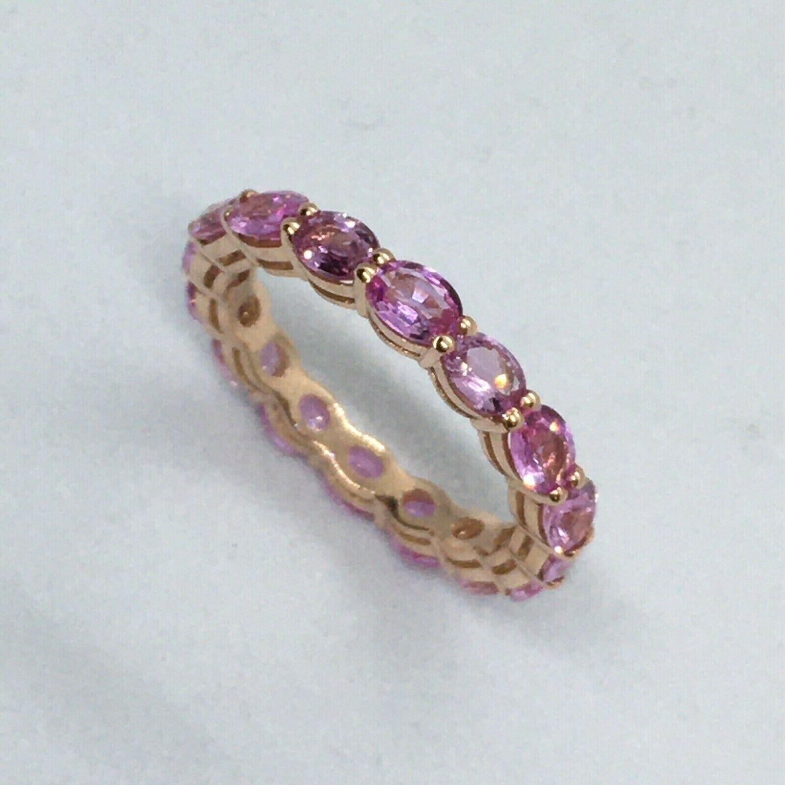 Nobel Gems presents 4.00 Ct Natural Oval Pink Sapphire Eternity Band 14k Rose Gold

Size 6 3/4
Weighing 2.3 gram
3 mm Double Wire setting
14K Rose Gold
4.00 Carat
4 mm by 3 mm Natural oval cut Pink Sapphire
3 mm band thickness
American made in Santa