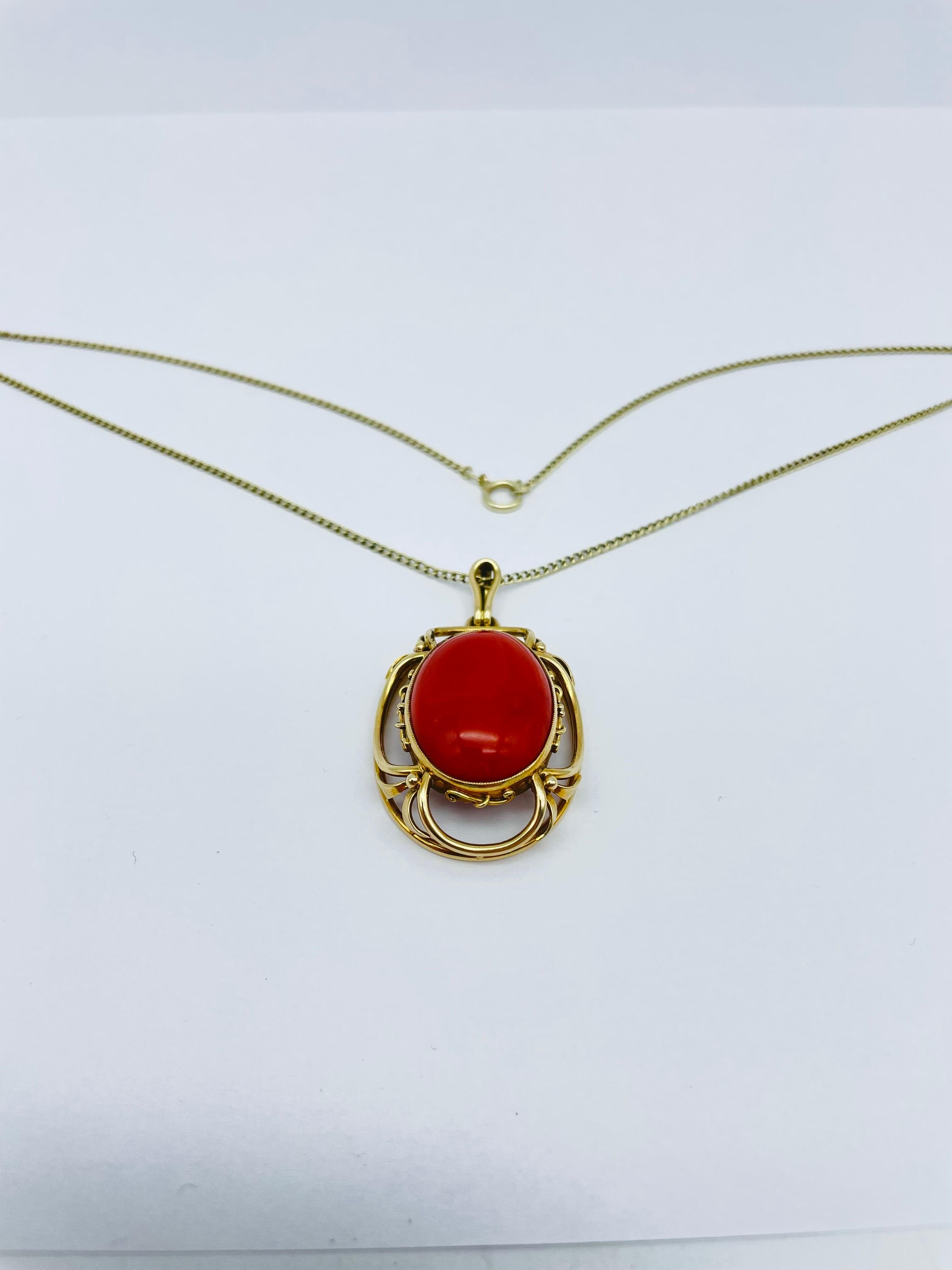 Noble 14K red coral pendant

14k yellow gold set with a large red coral cabochon. Finely designed gold mount with gold chain, also made of 14k yellow gold.

Dark red coral with grain