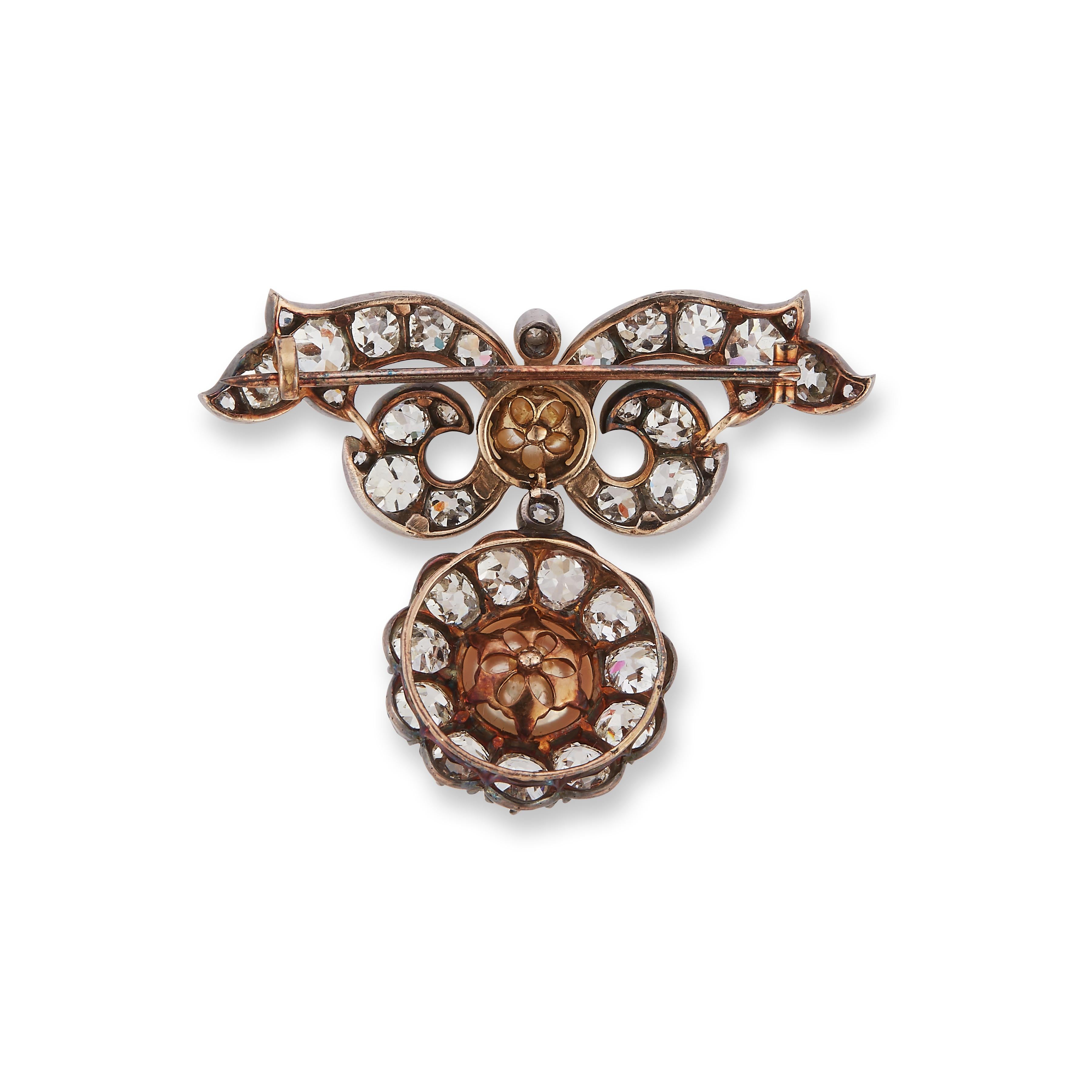 Estate Jewelry Curated by Parulina- Noble Collection Brooch with a 9.6mm and 8.7mm Natural Pearls surrounded by approximately 7.00ct of Old European Cut Diamonds. 

Metal: 18K Gold
Gemstone Size: 9.6mm and 8.7mm Natural Pearls
Diamond Carat Weight: