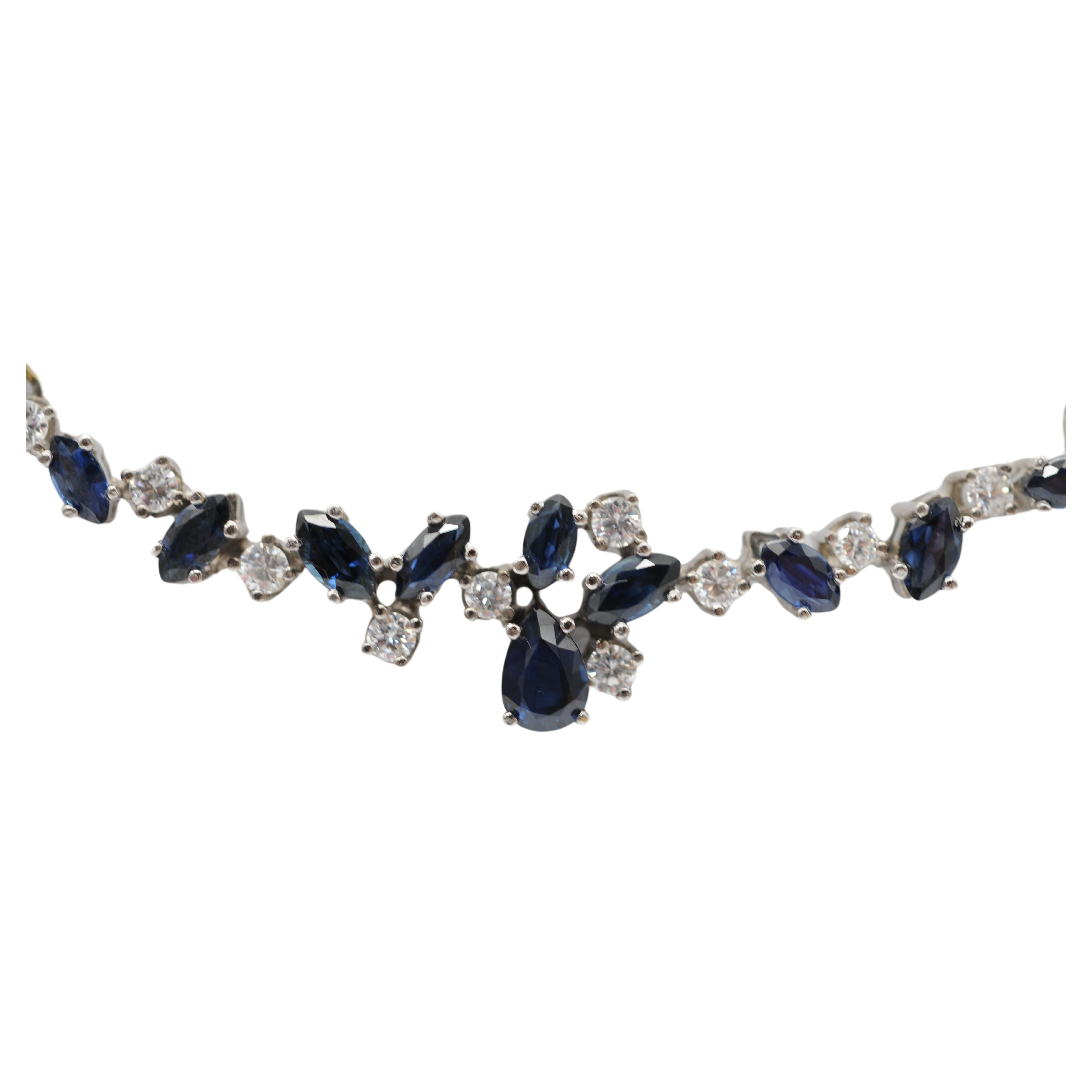 Discover the enchanting allure of this stunning 14k white gold necklace, an exquisite piece that embodies luxury and sophistication. This remarkable necklace is a true testament to refined elegance, featuring a harmonious blend of diamonds and blue