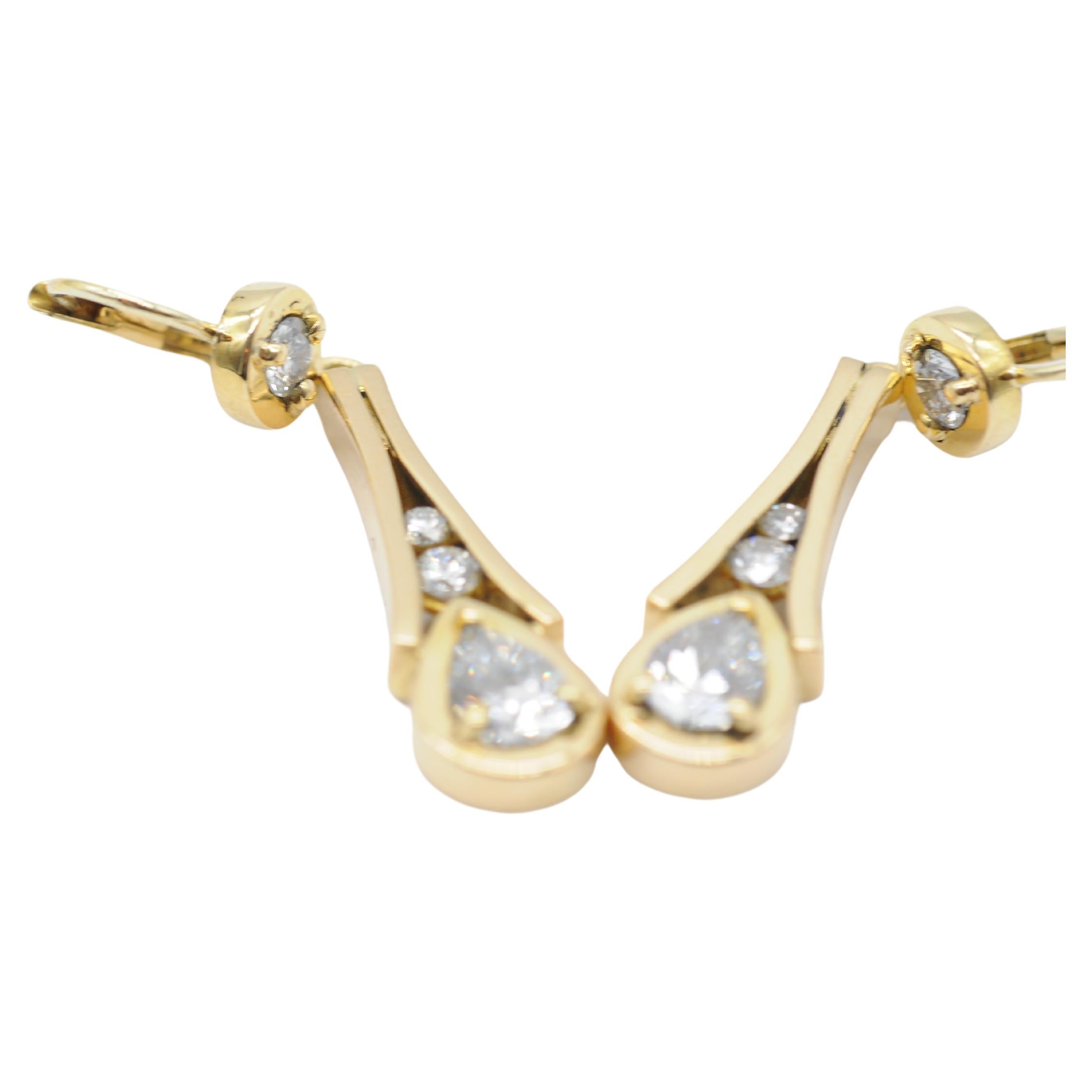 Aesthetic Movement Noble Earrings with pear cut diamond in 18 yellow gold For Sale