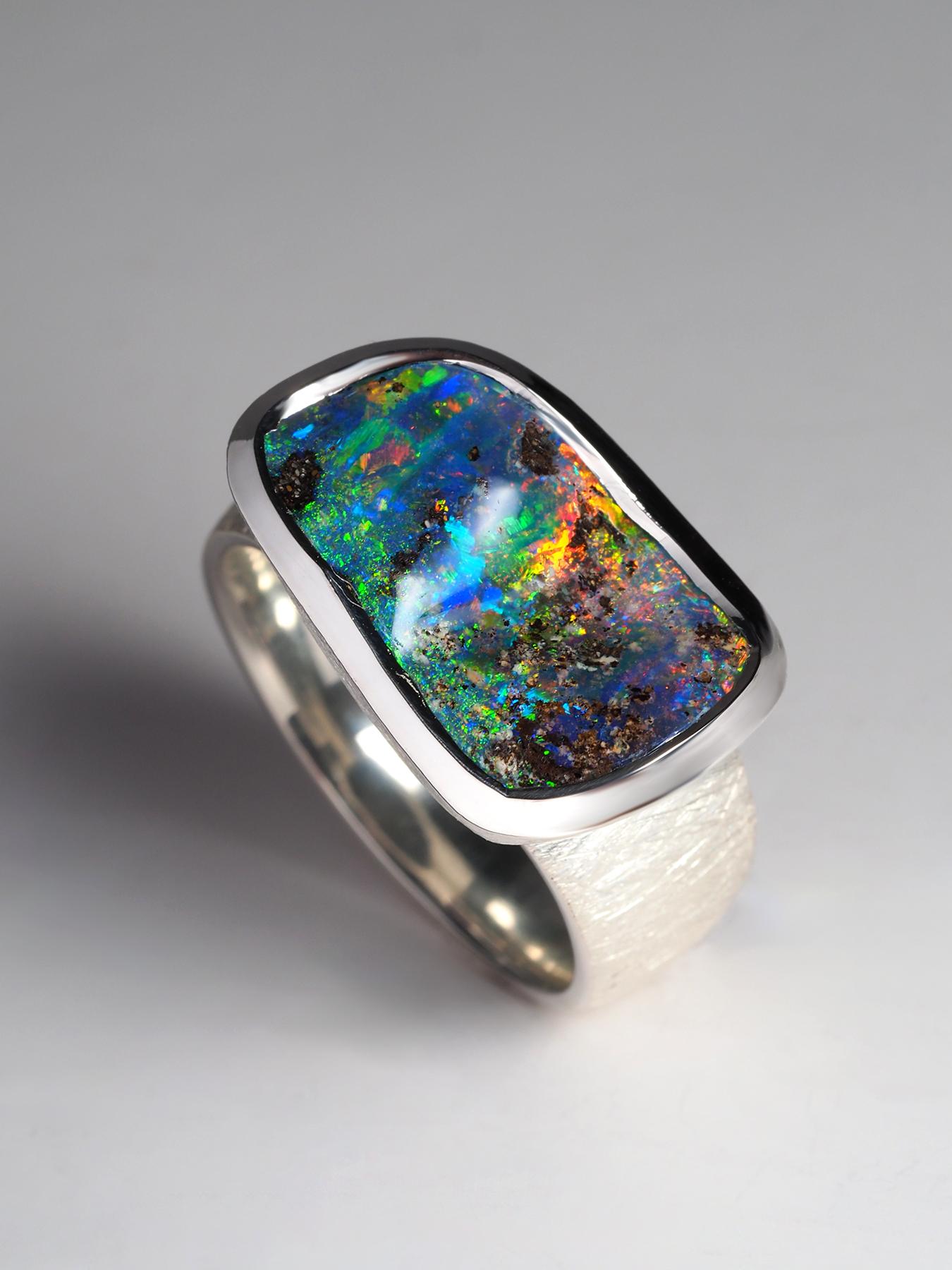 One of a kind silver ring with awesome natural Opal of 6.90 carats
Opal origin - Queensland, Australia
color of opalescence - red, blue, green, yellow, orange
size of the ring - 59 - N 19 - 8.75 US - diameter 18.75 (please send a message if you need
