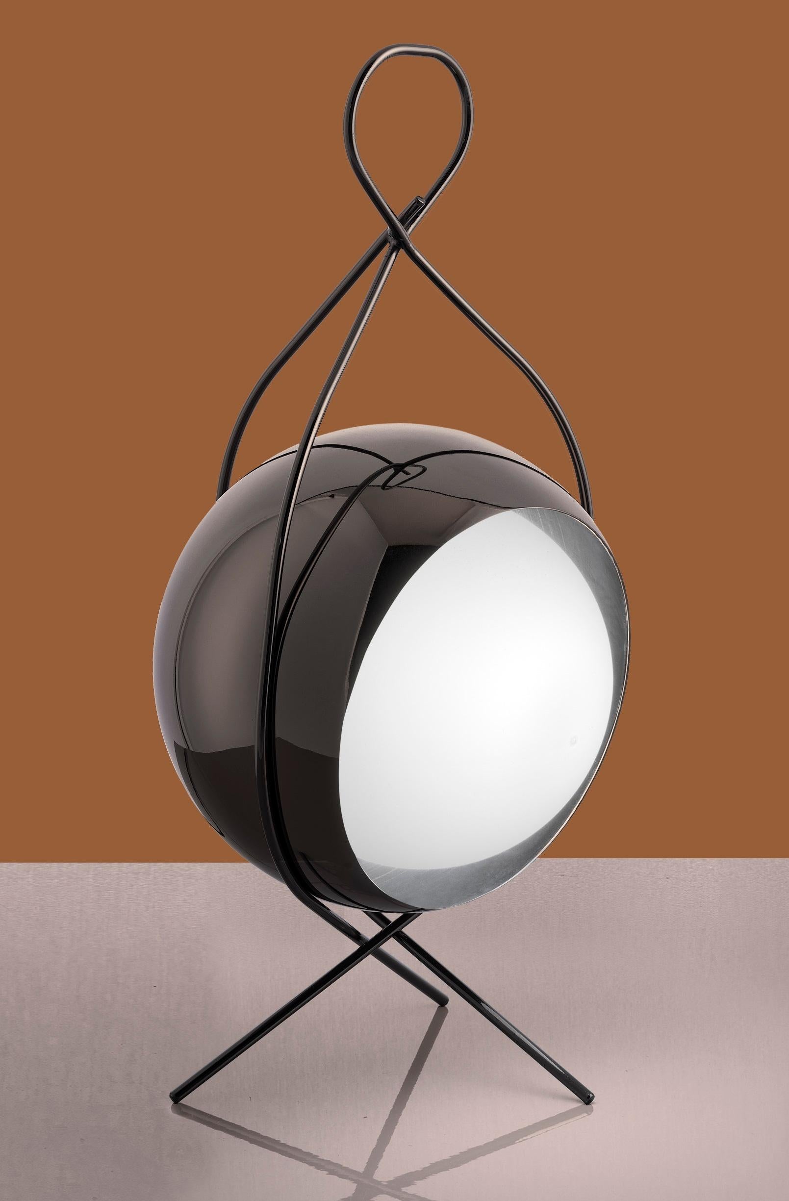 Nobody Small Table Lamp by Euroluce Lampadari
Dimensions: Ø 20 x H 32 cm.
Materials: Metal and plexiglass.

Available in different colors. Prices may vary. All our lamps can be wired according to each country. If sold to the USA it will be wired for