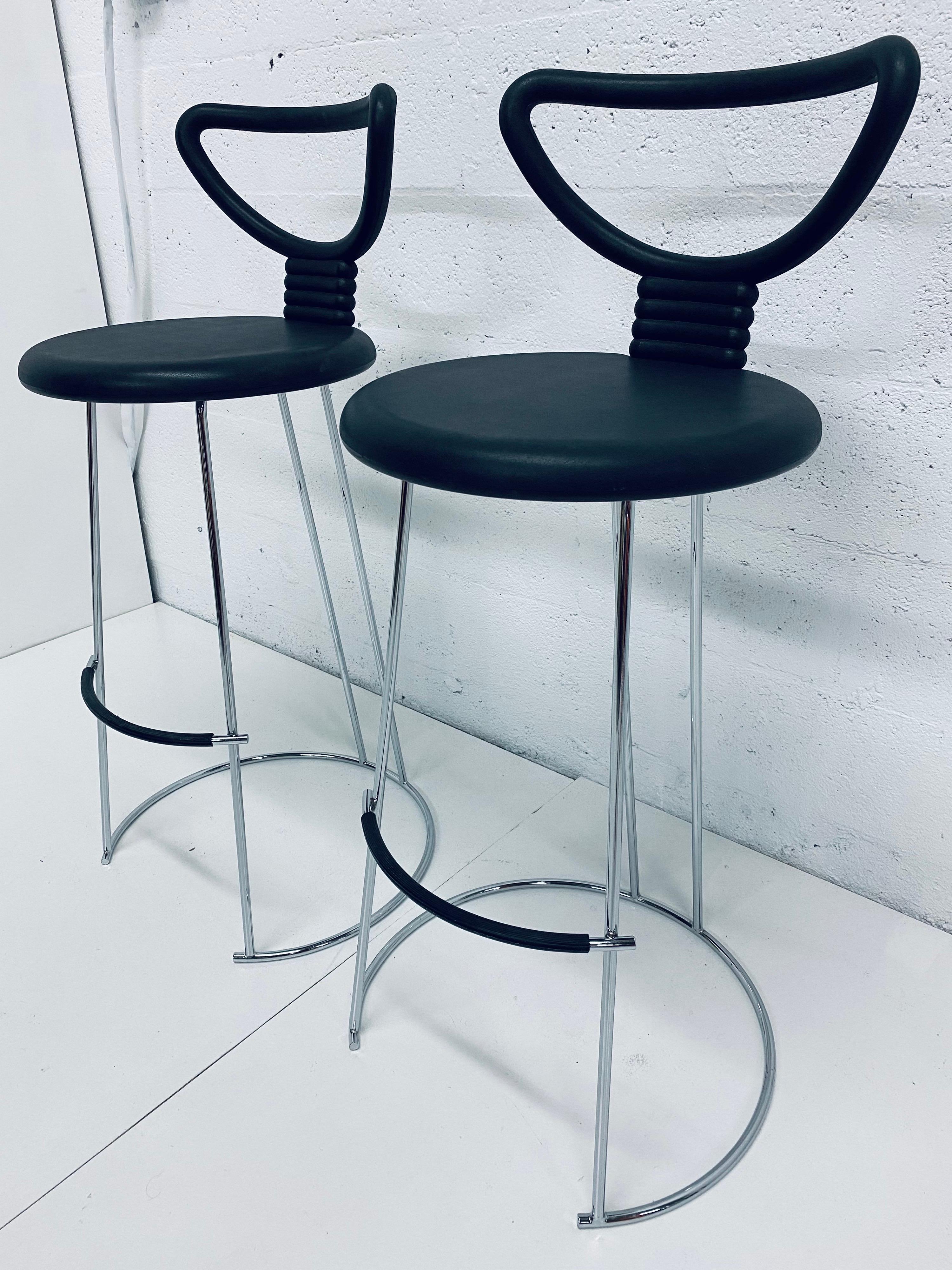 Pair of Nardis bar height stools with rubber like seats on a polished chrome frame designed by Nobu Tanigawa for Fasem Italy.