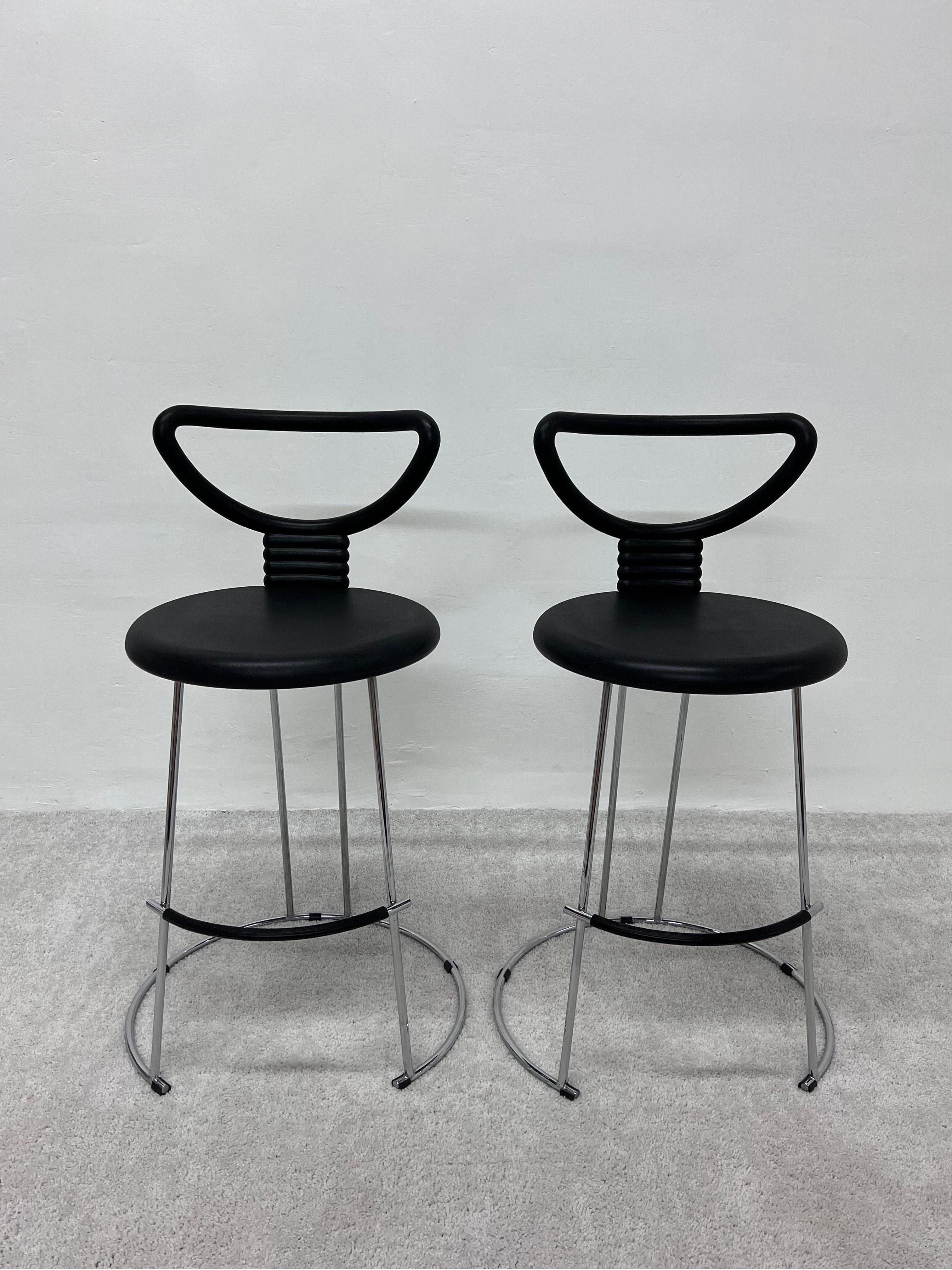 Pair of Nardis counter height stools with rubber like seats on a polished chrome frame designed by Nobu Tanigawa for Fasem Italy.