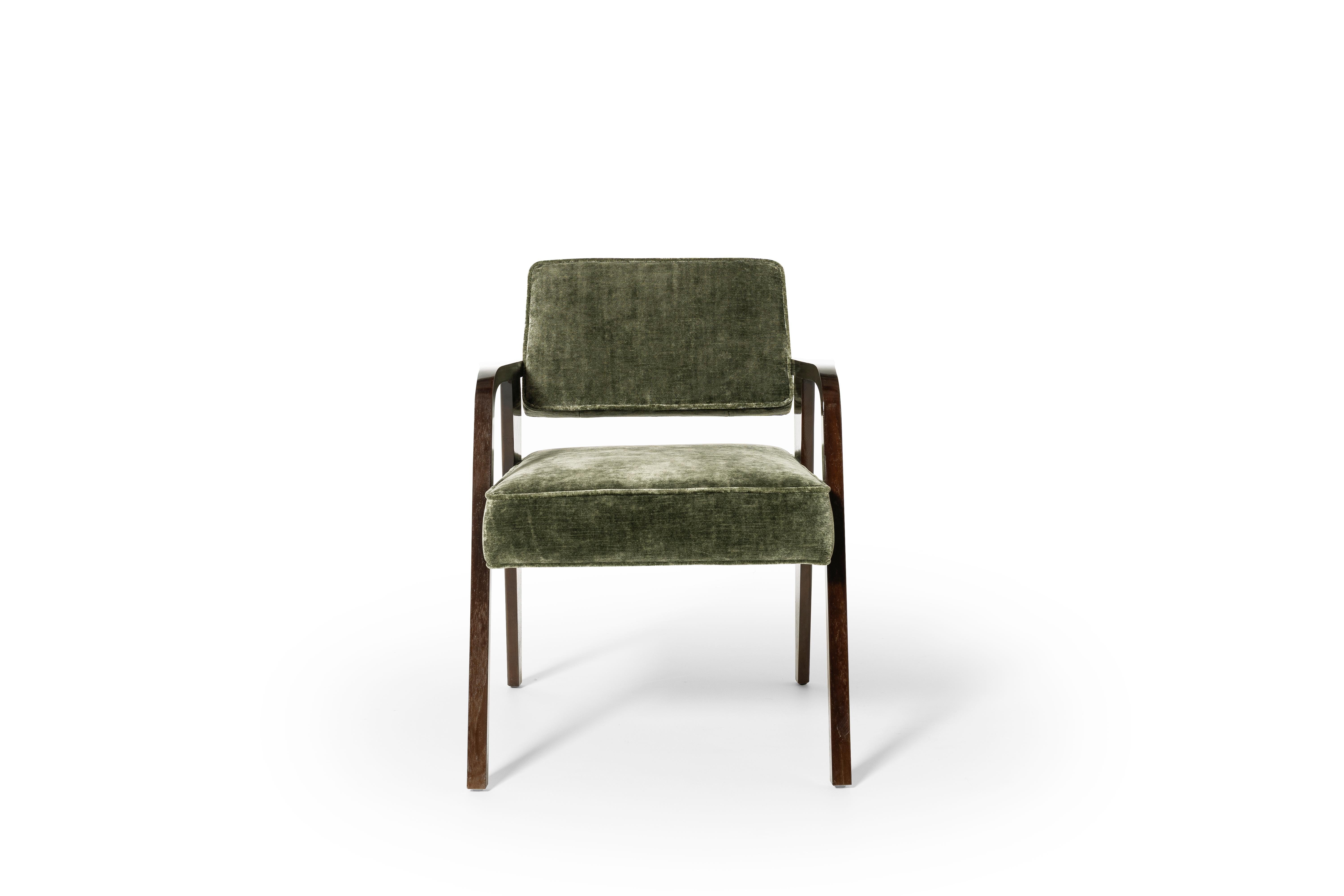 Made of solid walnut with high-gloss lacquer, this cocktail armchair enhances the contrast between the warm consistency of wood and the reflective surface of the lacquering, in a refined game of balance between tradition and modernity.
Available in