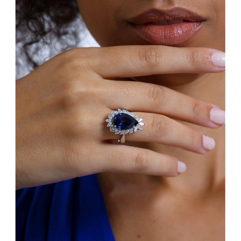 Modern 8.14ct Sapphire And Diamond Halo Ring For Sale