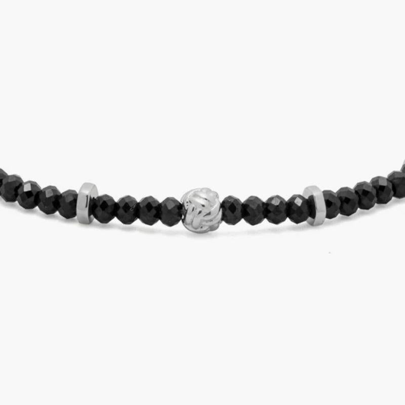 Nodo Bracelet with Black Spinel and Sterling Silver, Size L

Faceted black spinel beads sit together with accents of rhodium-plated sterling silver discs and finished with our lobster clasp. A hand-crafted unisex piece, with each raw stone cut to