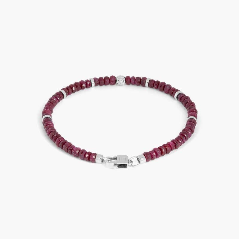 Nodo Bracelet with Ruby and Sterling Silver, Size L

Faceted ruby beads sit together with accents of rhodium-plated sterling silver discs and finished with our lobster clasp. A hand-crafted unisex piece, with each raw stone cut to attract the