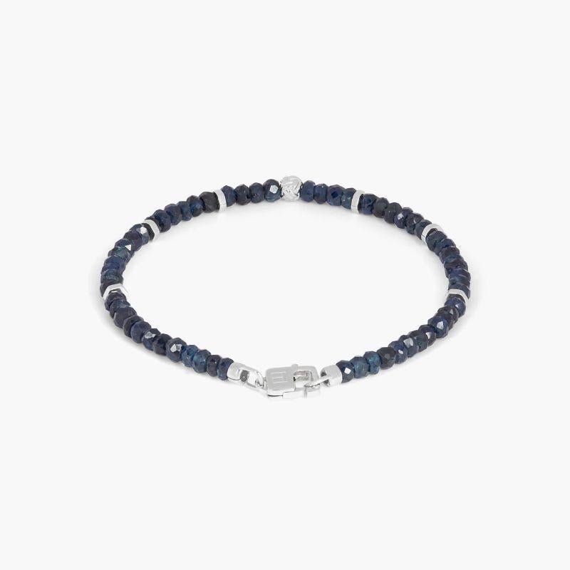 Nodo Bracelet with Sapphire and Sterling Silver, Size XS

Faceted sapphire beads sit together with accents of rhodium-plated sterling silver discs and finished with our lobster clasp. A hand-crafted unisex piece, with each raw stone cut to attract
