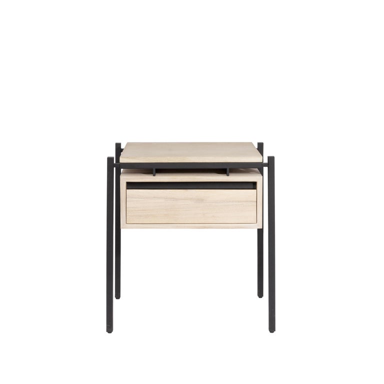 The modernist architecture of Richard Neutra served as inspiration for the Nodo Nightstand with its metallic details of steel in electrostatic paint and covered in wood veneer in the drawer and top. This overbed table is perfect for spaces that