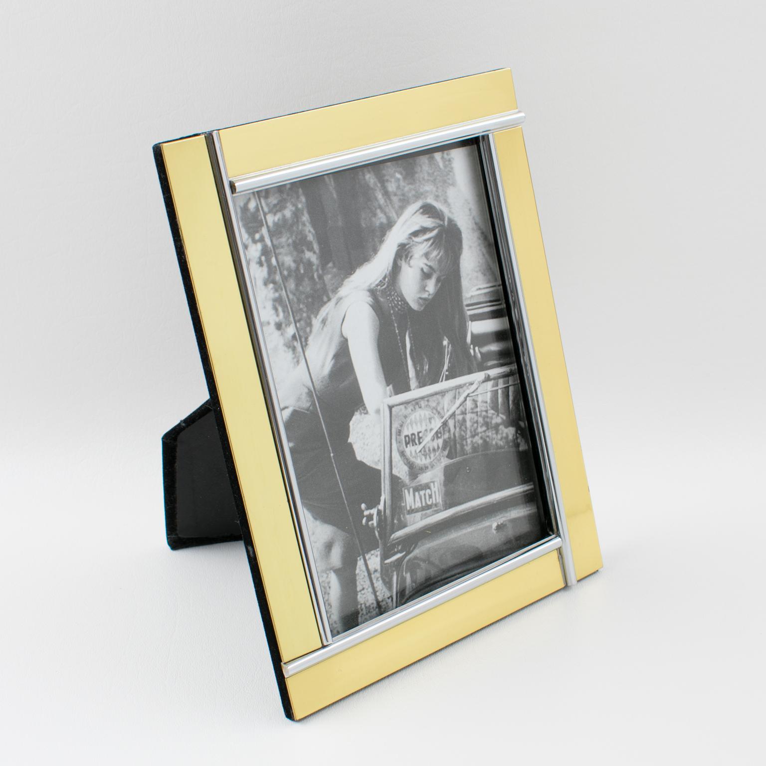 Elegant 1970s picture photo frames attributed to Noel B. C., Italy. Gilt brass and chrome geometric design with kinetic effect. Easel and back in black velvet. Picture photo frame can be placed in portrait or in landscape