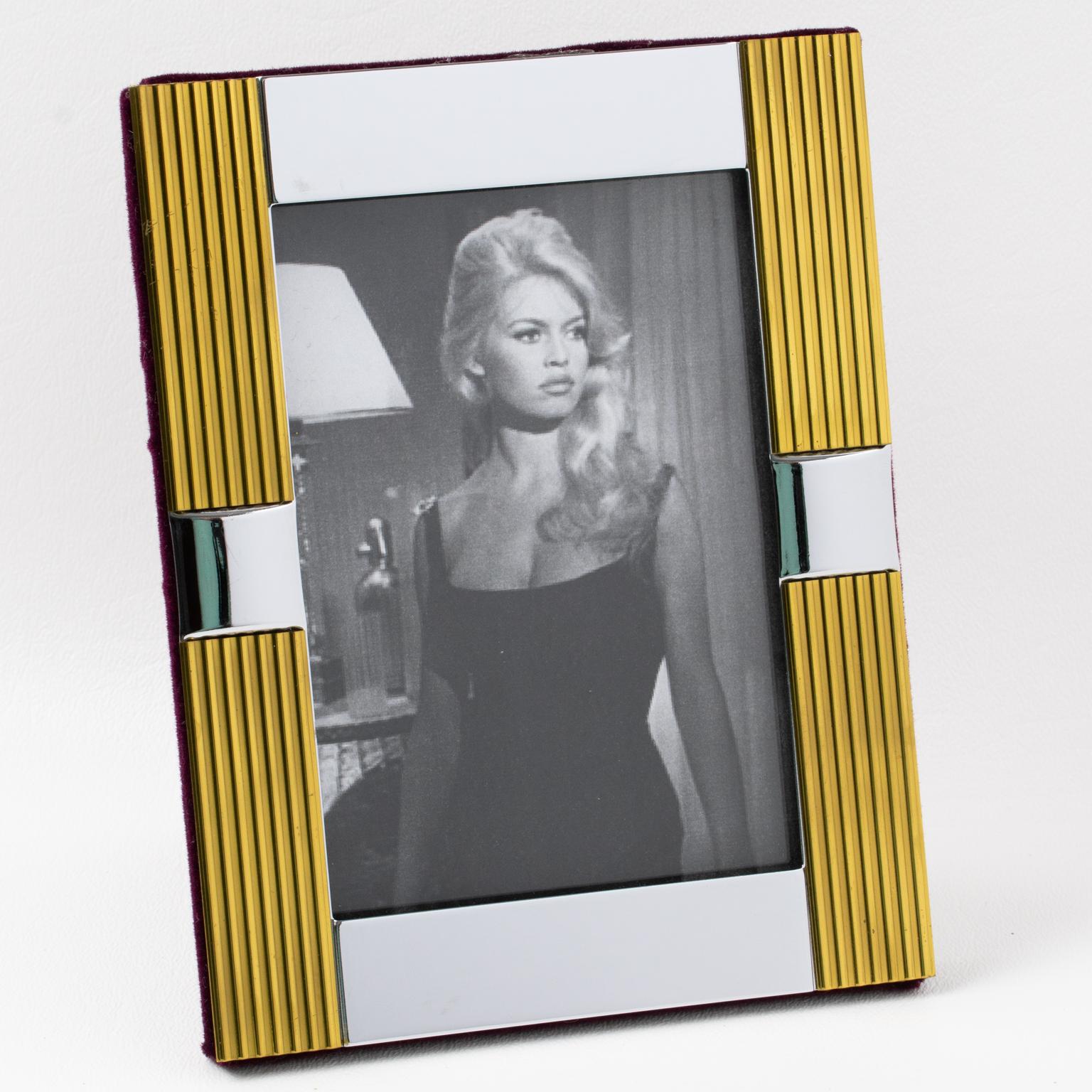 Noel BC company, Italy, crafted this charming Italian picture photo frame in the 1970s. The chrome and gilded brass metal modernist geometric design has a striped design. The easel and back are in purple velvet, and a glass insert is on the front to