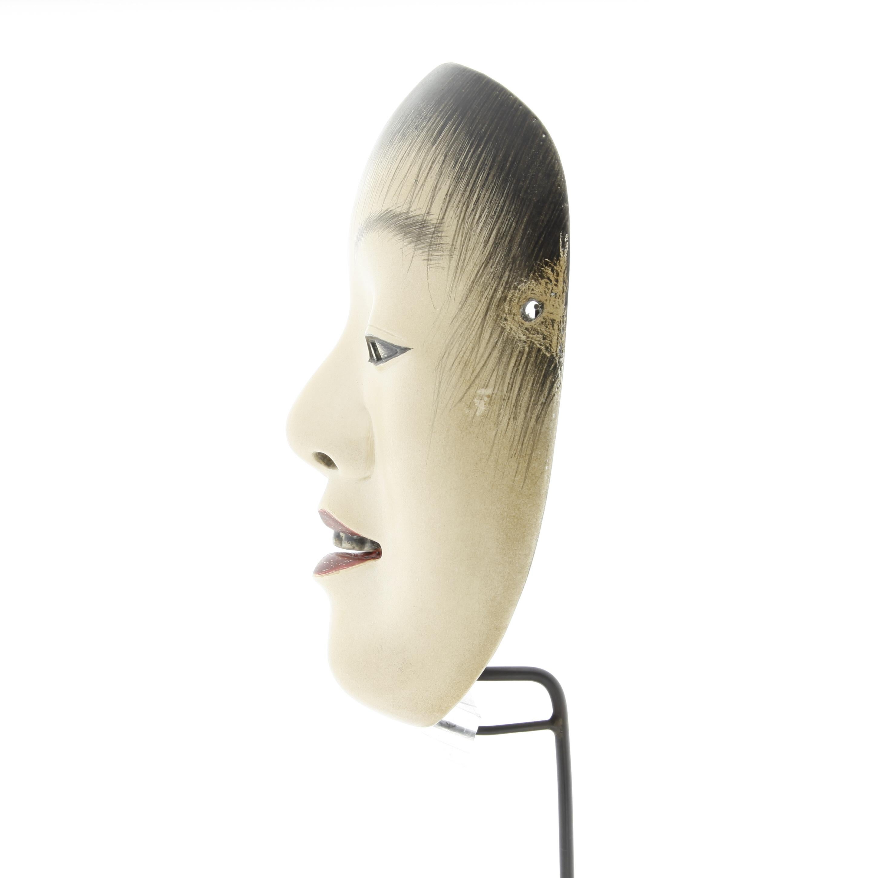 Doji - Noh mask of a young boy

Date: 19th century
Size: 20.5 x 14 cm

Doji represents a young boy, with a face slightly rounded and feminine, almost androgynous. Although in Japanese the word 'doji' means 'child', in Noh it refers to a divine