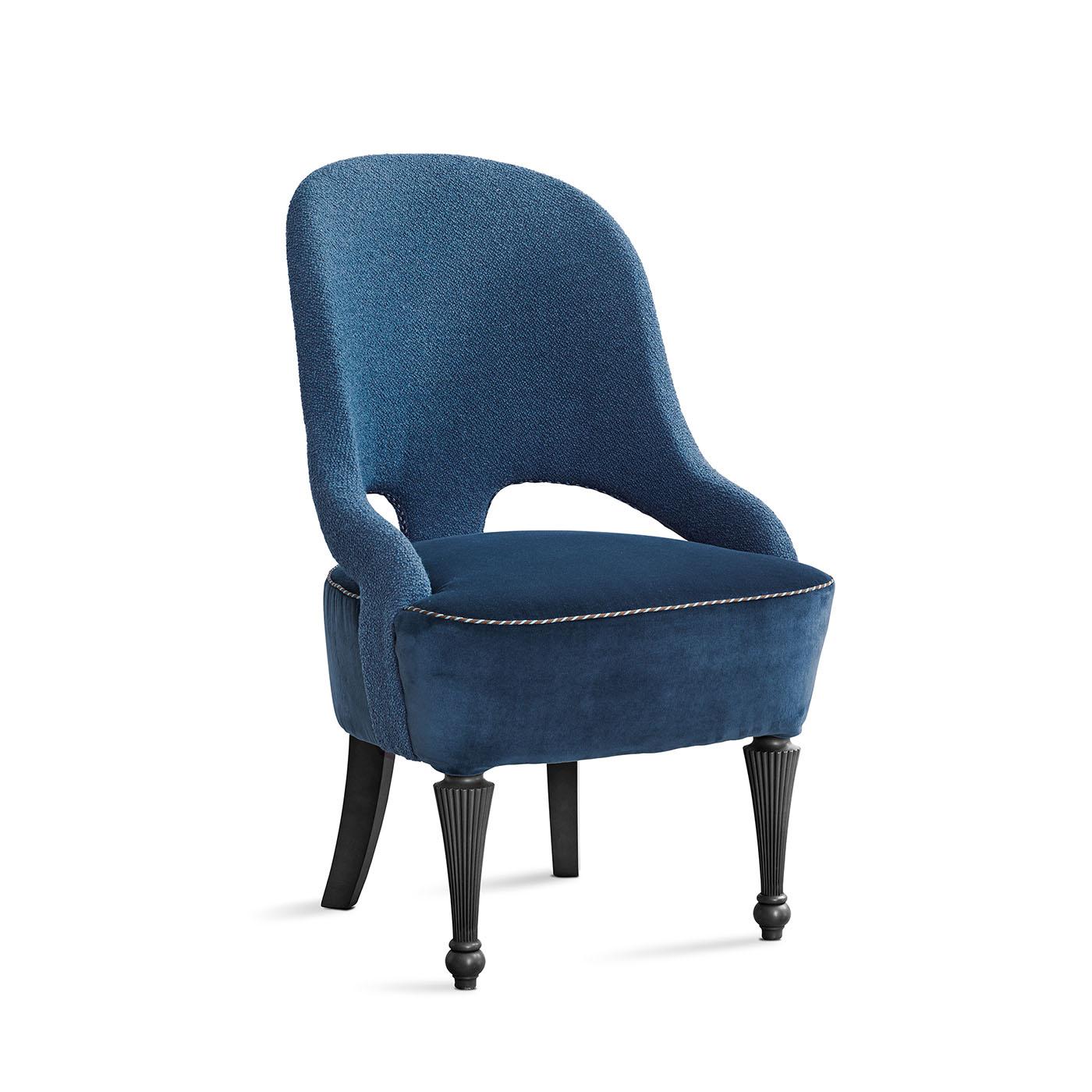 This chair showcases a harmonious combination of textures, featuring a bouclè backrest, a velvet seat, and elegantly embellished piping, all supported by beautifully turned wooden legs.