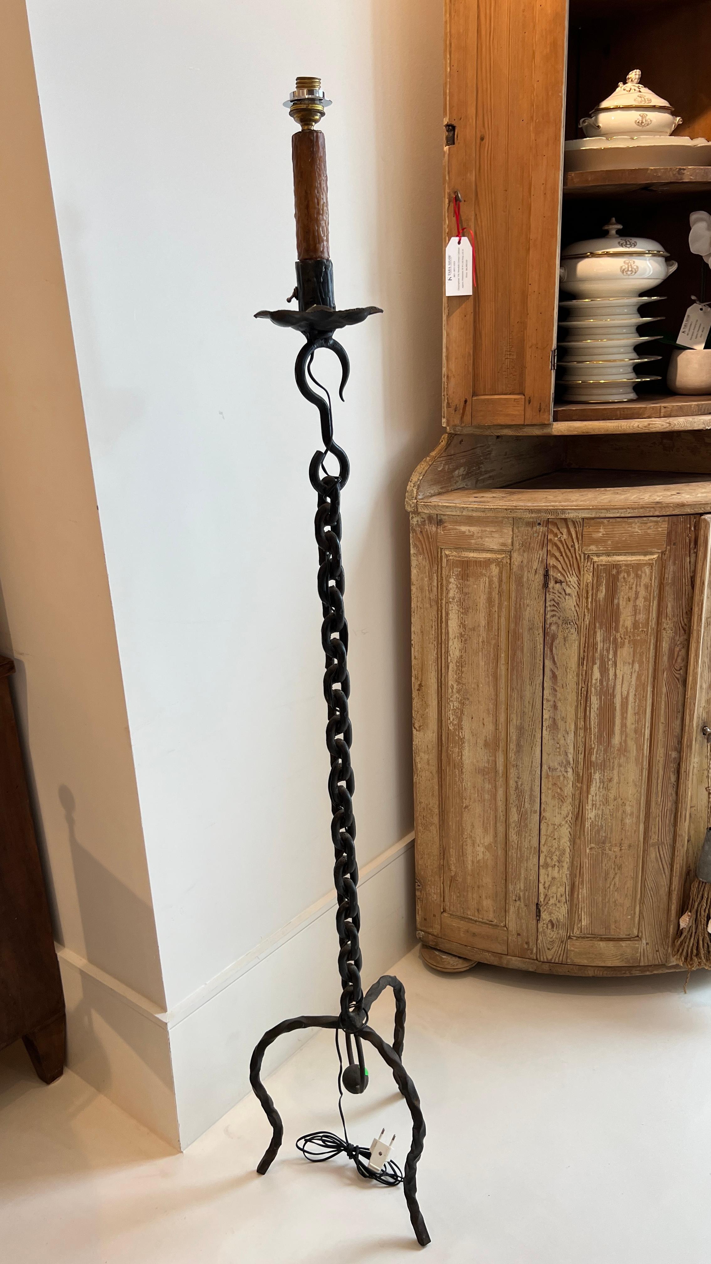 Black vintage wrought iron chain link floor lamp with shade. Industrial chic addition to a room.

Has been wired for US but not UL Listed